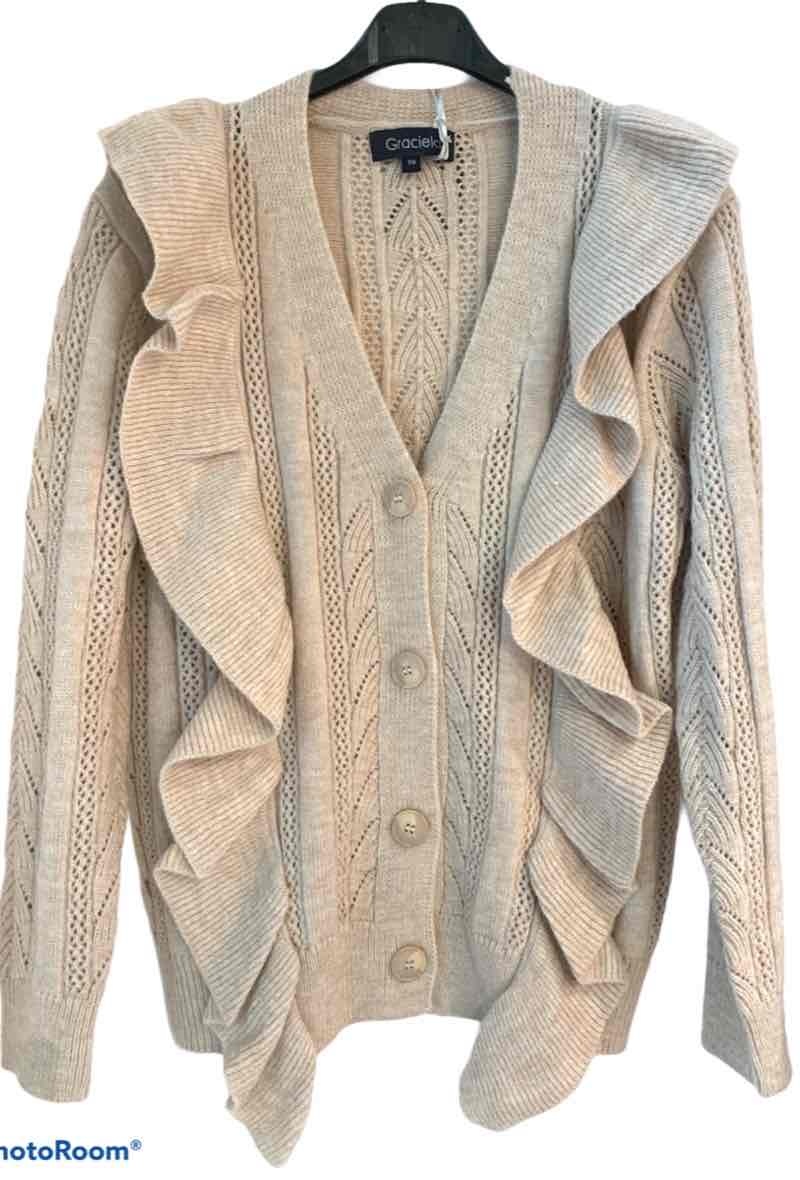 Grossiste Graciela Paris - Gilet à boutons. jeu de volants sur chaque cote du buste