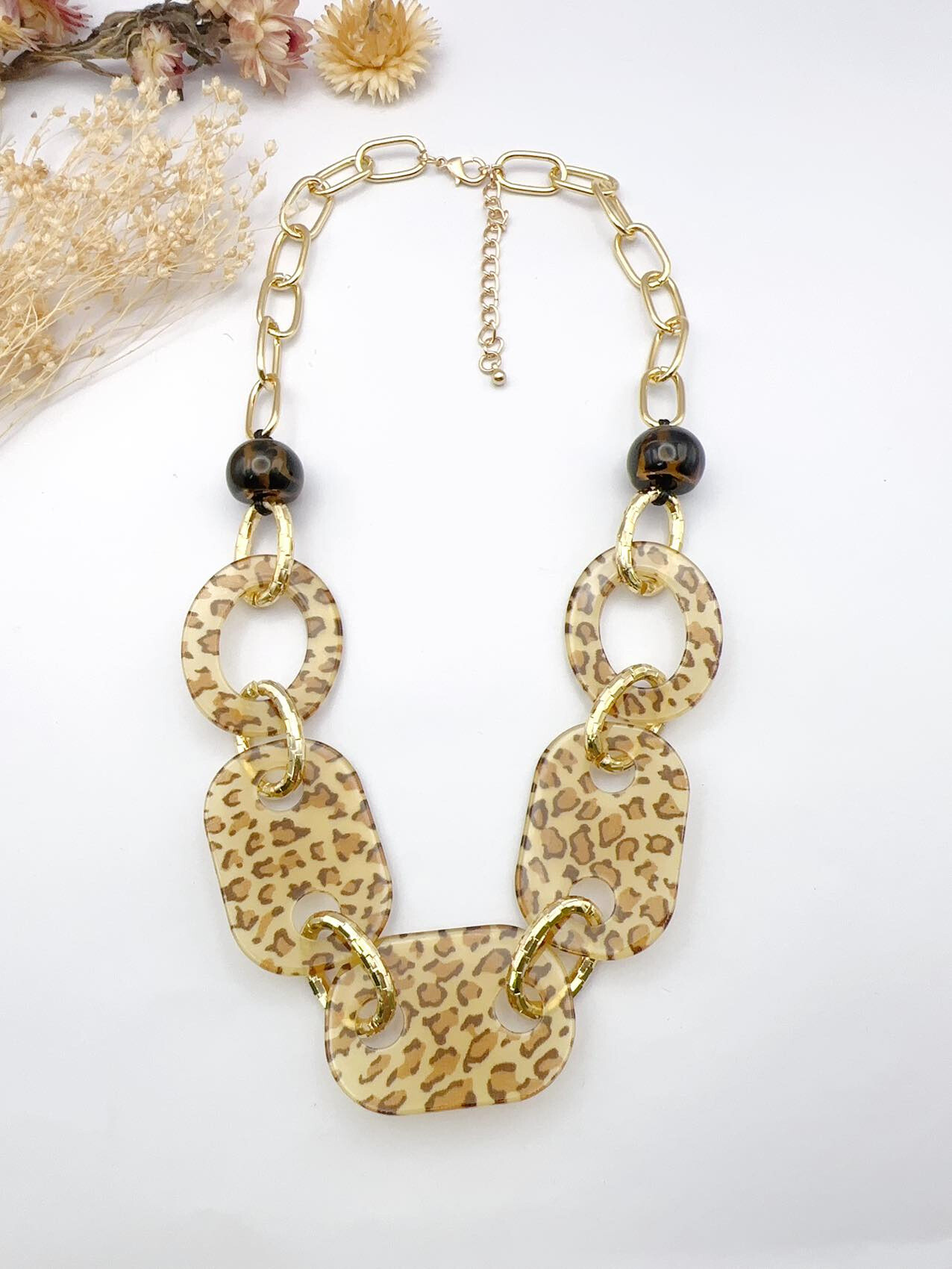 Großhändler H&T Bijoux - Leoparden-Halskette aus Edelstahl und Harz.