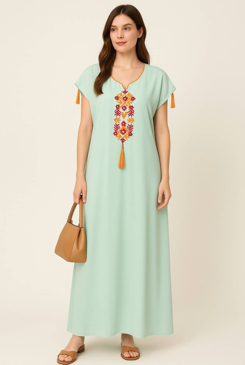 short abaya dress This beautiful seasonal dress is designed for comfort and effortless style. It features a round neckline with a short zipper down to the chest, combining practicality with a clean, elegant look. The