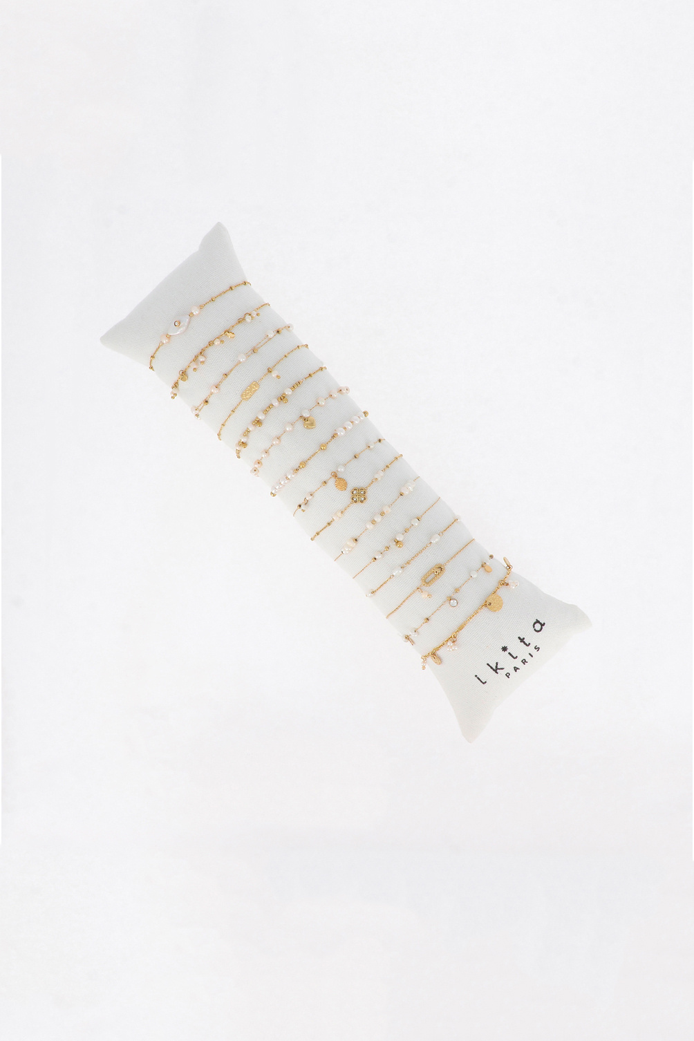 Großhändler Ikita Paris - Set mit 15 Armbändern. Kissen gratis. Durchschnittspreis: 4,40 € zzgl. MwSt.