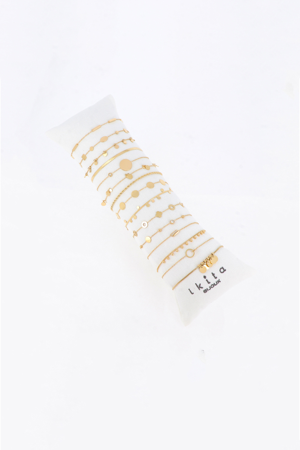 Großhändler Ikita Paris - Set mit 15 Armbändern. Kissen gratis. Durchschnittspreis: 4,00 € zzgl. MwSt.