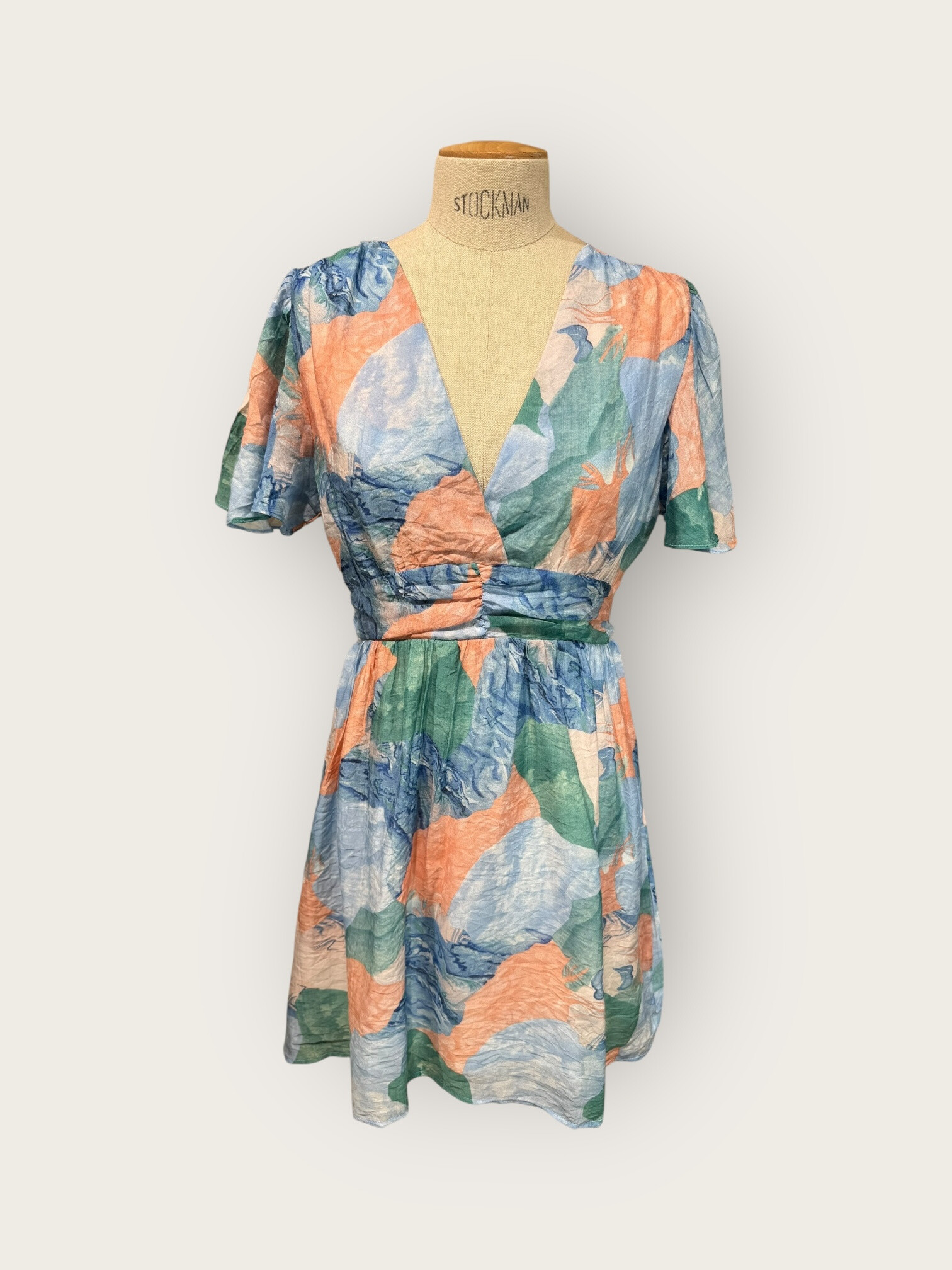 Mayorista In April 1986 - Vestido fluido corto con estampado pastel y escote cruzado
