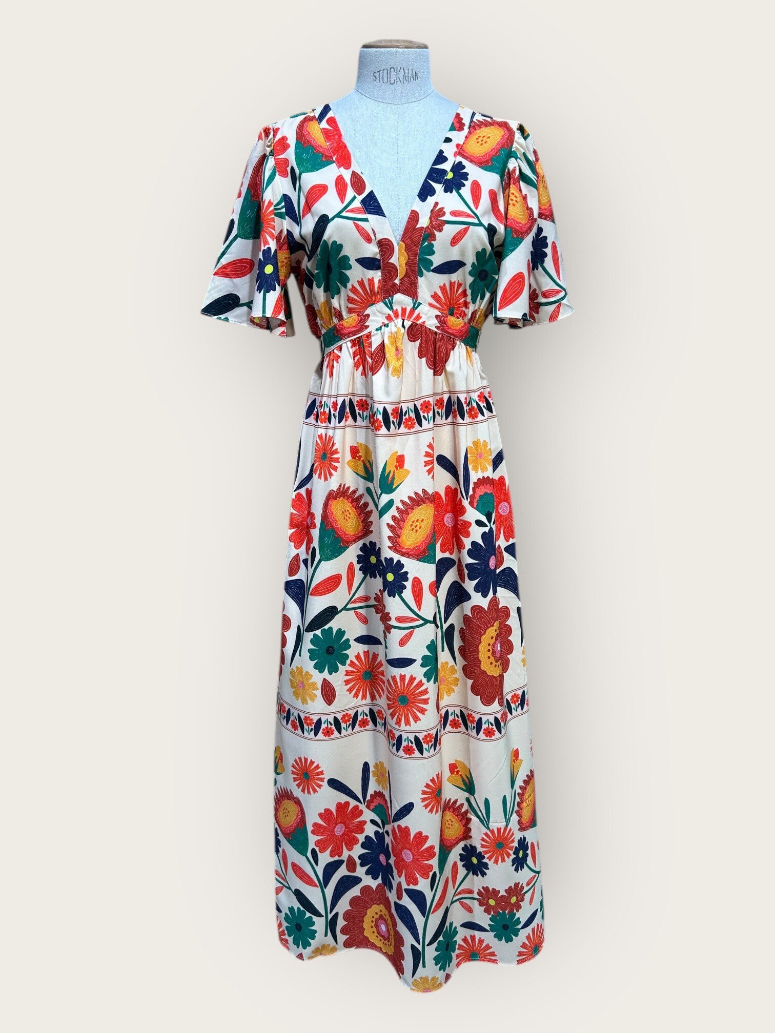 Wholesaler In April 1986 - Long dress with floral and colorful print.