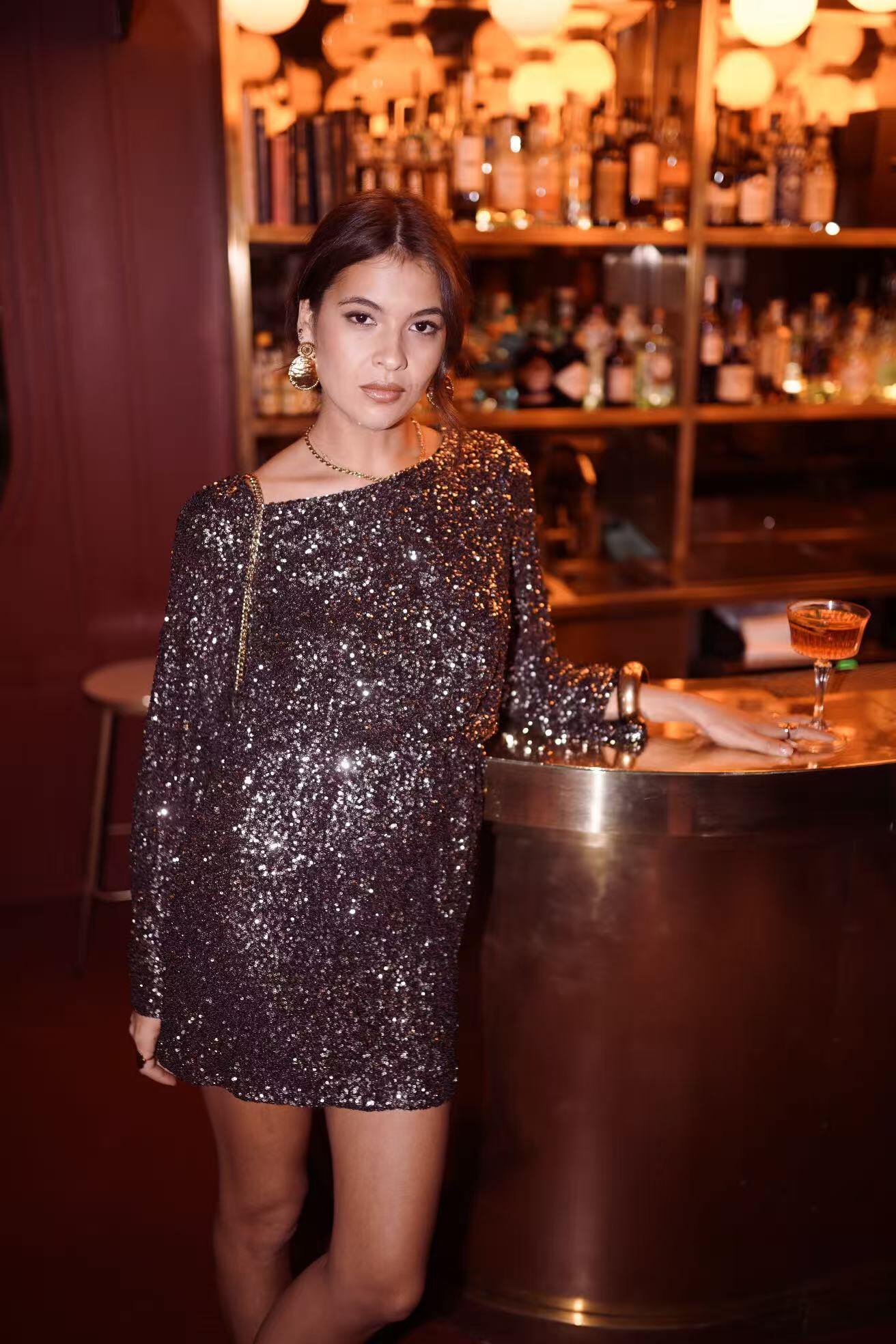 Wholesaler In April 1986 - Short black sequin dress – flared sleeves.