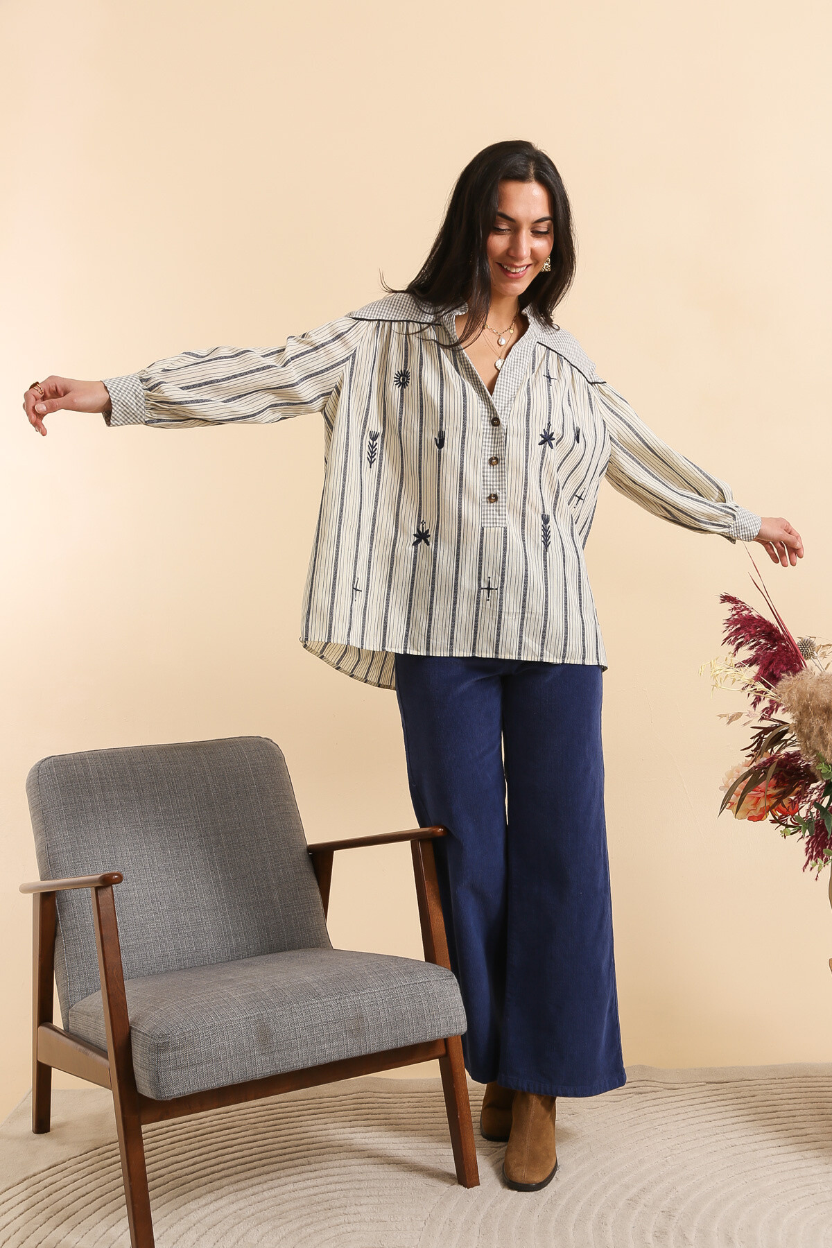 Wholesaler Inspiration Studio - Loose striped cotton blouse with embroidered patterns.