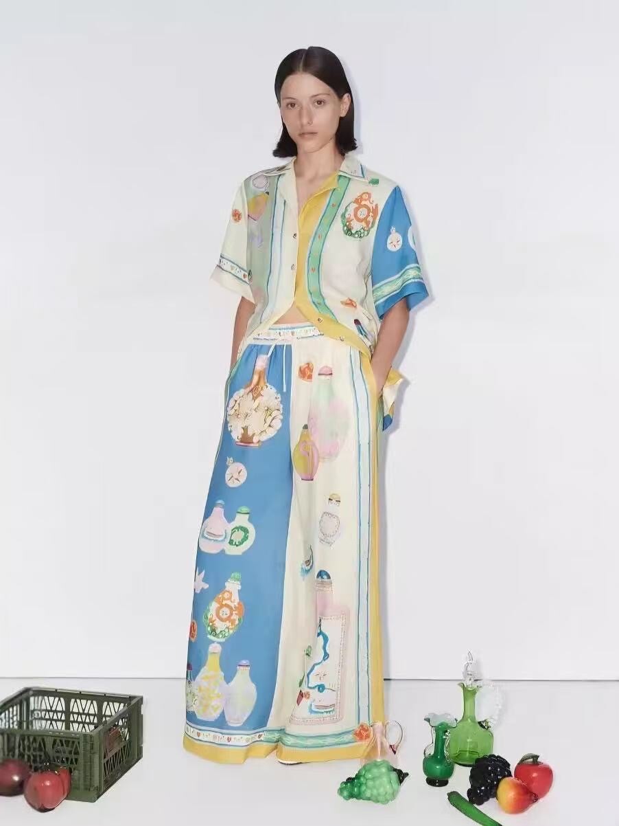 Grossista J&L - Completo Camicia a Collo Aperto e Pantaloni Larghi con Stampa Illustrata
