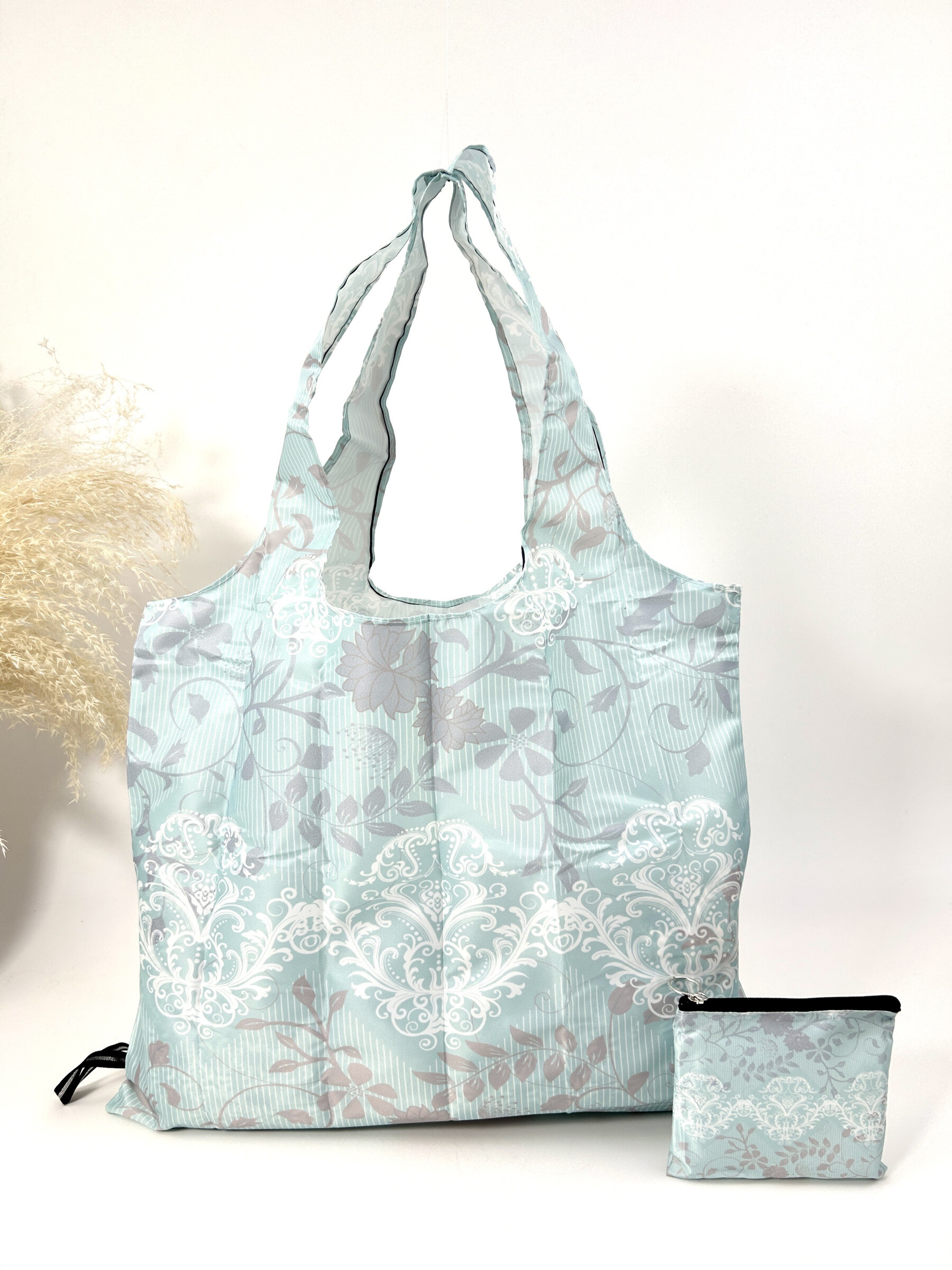 Wholesaler Jade&Clarisse - Racing bag with tropical plant print holds in the pocket