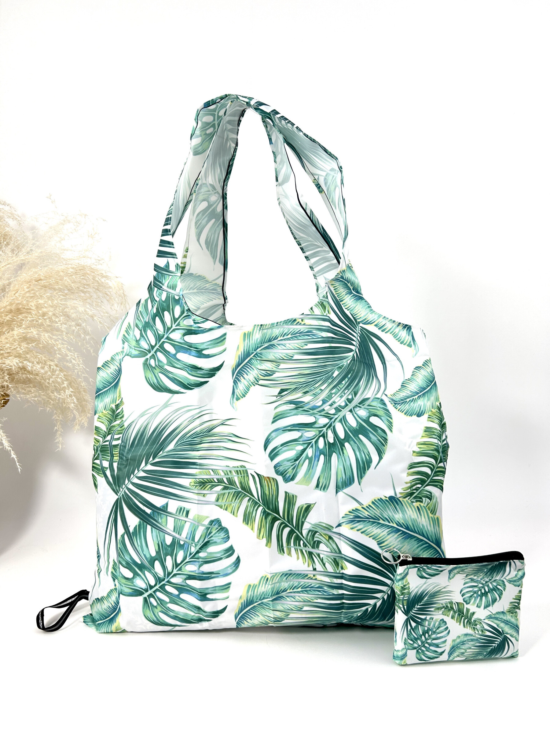 Wholesaler Jade&Clarisse - Racing bag with tropical plant print holds in the pocket