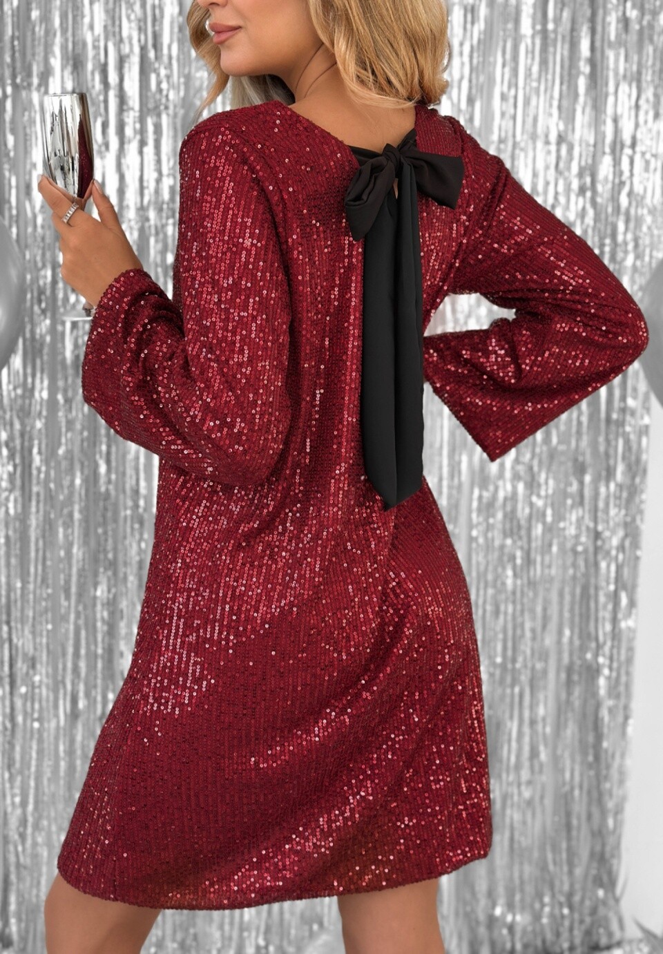Sequin Dress with Bow Back – Festive Elegance & Glamorous Appeal

Shine bright with this chic and refined sequin dress, designed to enhance all your evening events.
Its fully sequined fabric catches the light with every move, while the large bow at the back adds a unique touch of femininity and elegance.

✨ Product Details:

Fit: slightly fluid straight cut, short (above the knee)

Neckline: round at the front, open back adorned with a large black velvet bow

Sleeves: long, for a look that's both glamorous and refined

Material: soft fabric entirely covered with shiny sequins

Lining: fine and pleasant for optimal comfort

Closure: slip-on, no zipper

Key Detail: contrasting velvet ribbon bow, open back

🎨 Available Colors:

Deep Black

Bright Champagne

Bordeaux Red

Golden Brown

📏 Available Sizes:
S – M – L – XL-XXL
(The slightly loose fit adapts to all body shapes.)

🧵 Composition:
 100% polyester

💃 Perfect for:
Evenings, parties, weddings, New Year's Eve, birthdays, or cocktails — a piece that effortlessly combines elegance and sparkle.

🖤 Style Tip:
Pair it with high heels and gold jewelry for a chic glamorous look. Let the open back and bow make the statement!