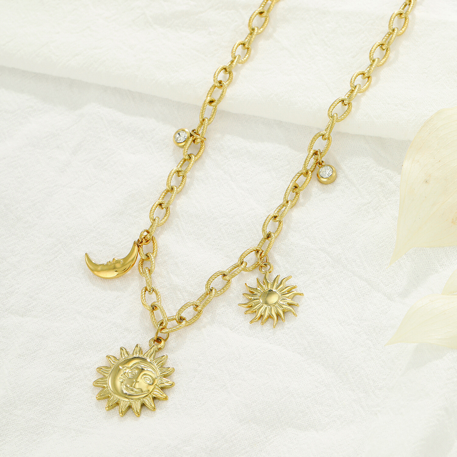 Grossiste Kapyco - Collier maillons breloques soleil en acier inoxydable