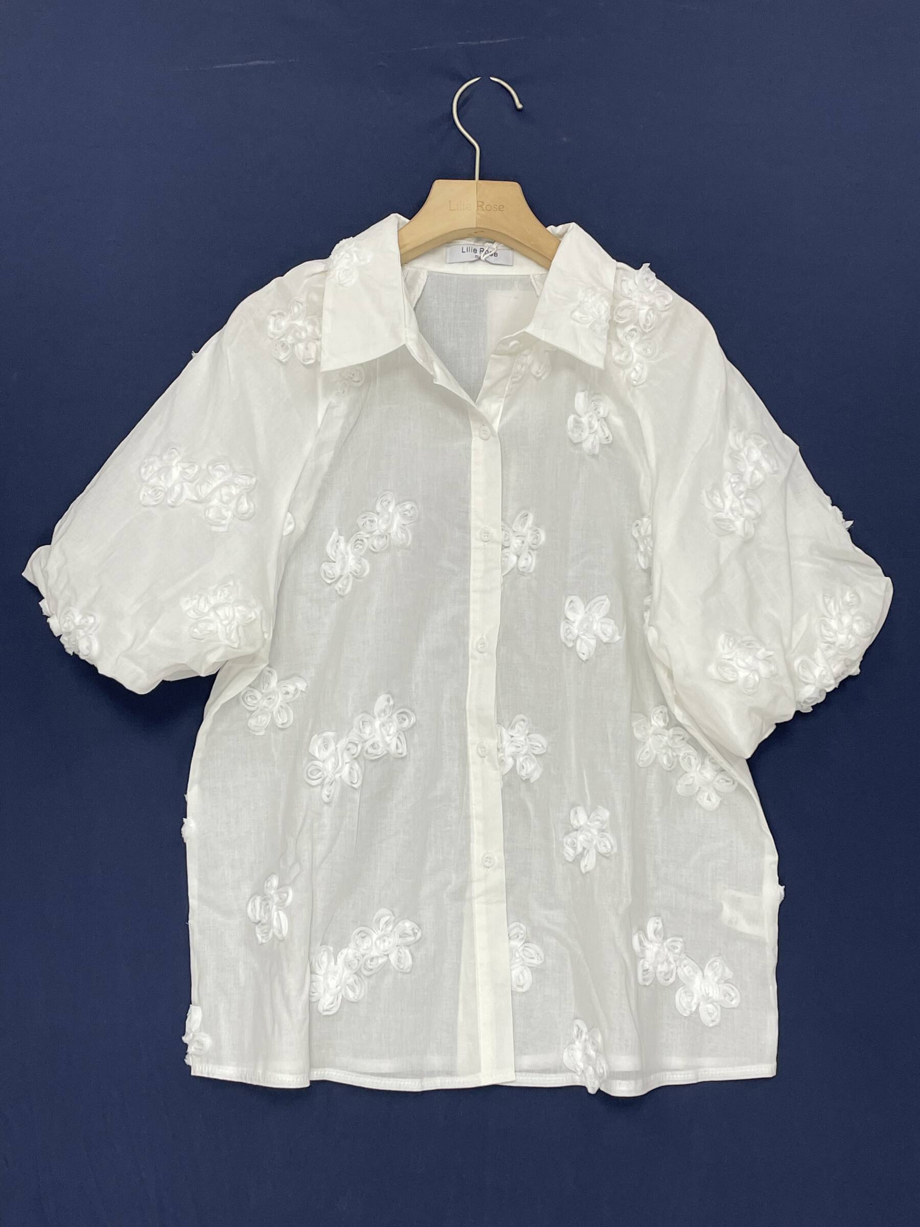 White cotton shirt, short sleeves, perfect for summer. Made in China for the Spring/Summer 2026 collection.