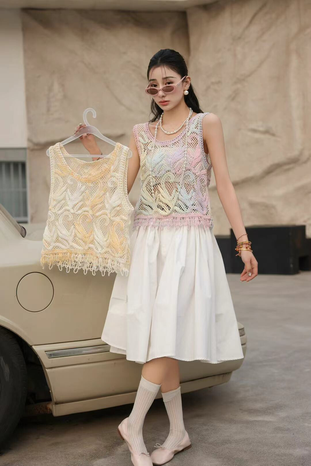 Grossista LILLA - TOP A MAGLIA SENZA MANICHE ALL`UNCINETTO OCEAN SWIRL CON MARGINALE NAPPA