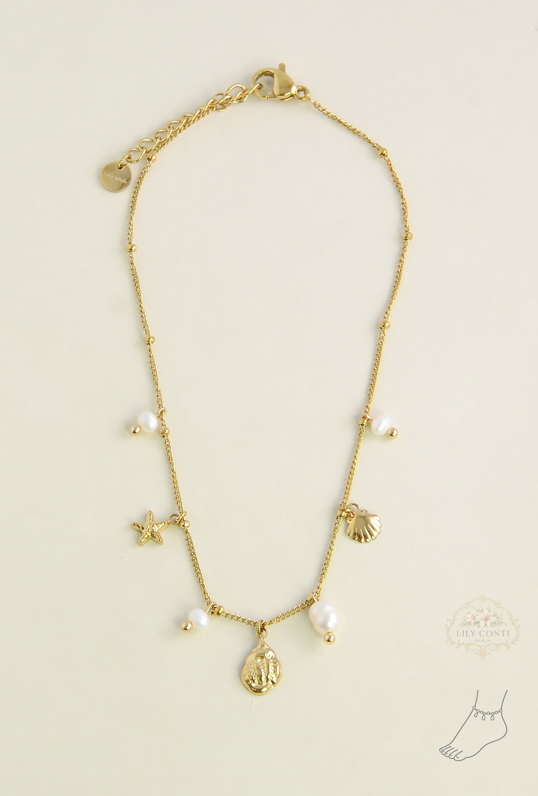 Mayorista LILY CONTI - Tobillera dorada de acero inoxidable con perlas de agua dulce y dijes marinos