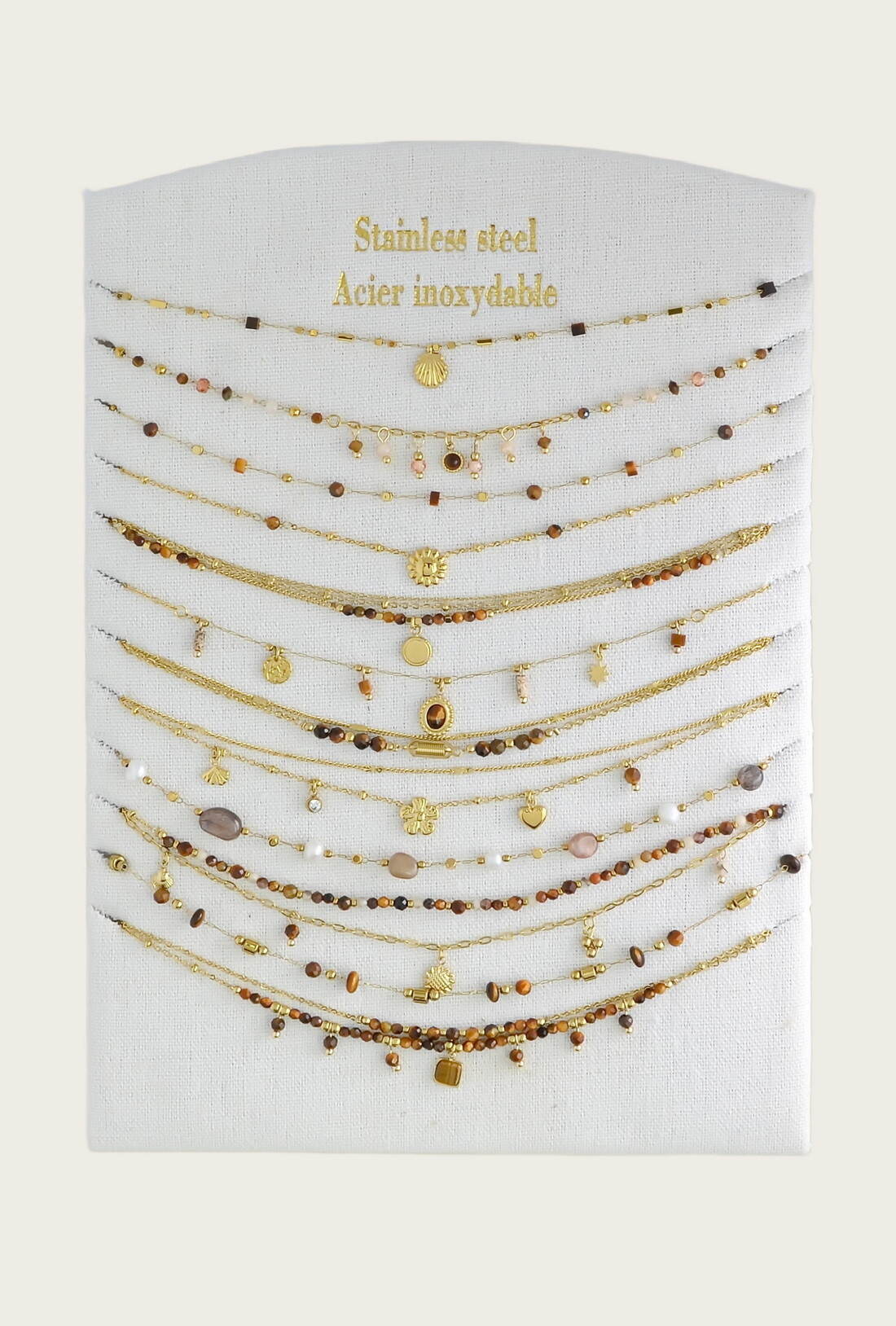 Grossiste LILY CONTI - Lot de 12 colliers en acier inoxydable doré – pierres & autres matériaux