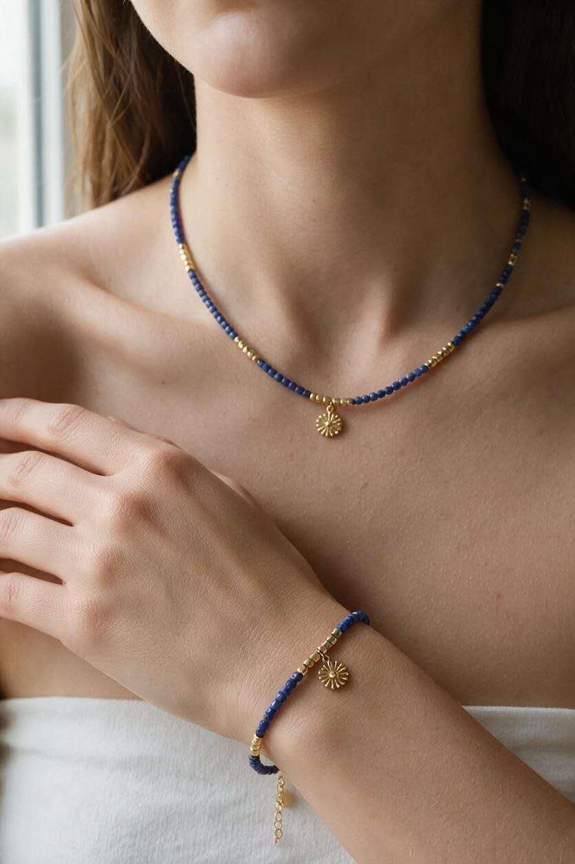 Grossista LILY CONTI - Set collana e bracciale dorati in acciaio inossidabile con pietre, perle di vetro sfaccettate e ciondolo sole