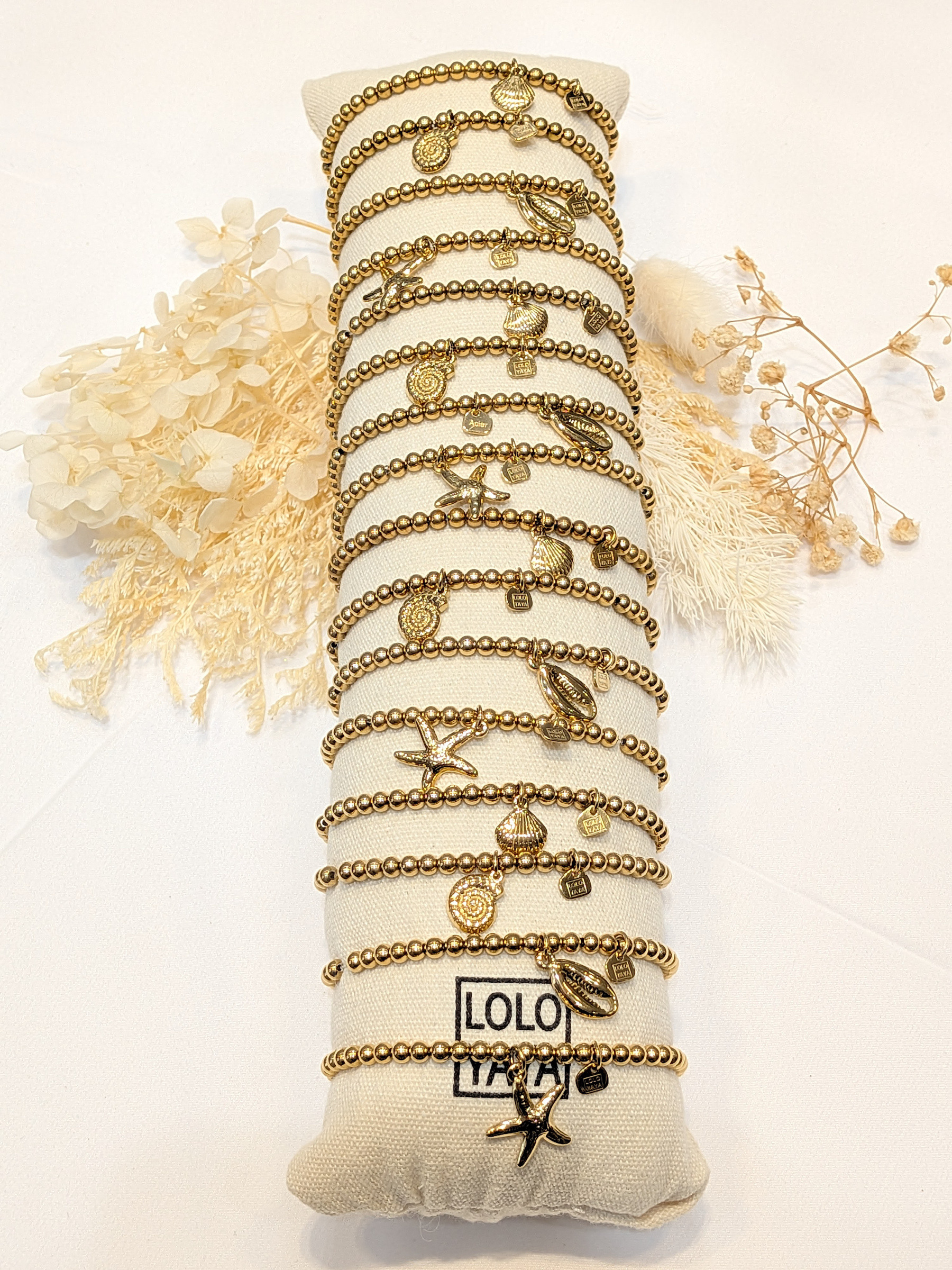 Wholesaler LOLO & YAYA - Set of 16 elastic bracelets with charms, 3 € 50/pc