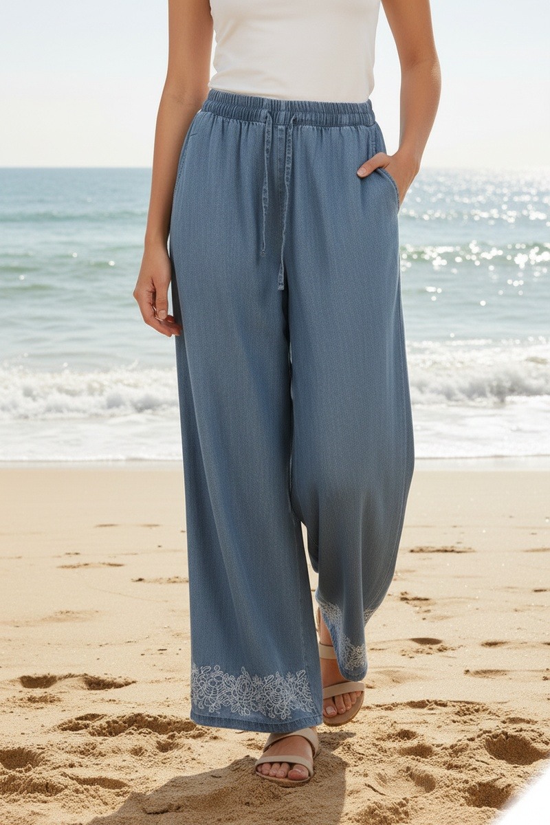 Mayorista Lusa Mode - Pantalón liso color vaquero con bordado floral, cinturón y bolsillos