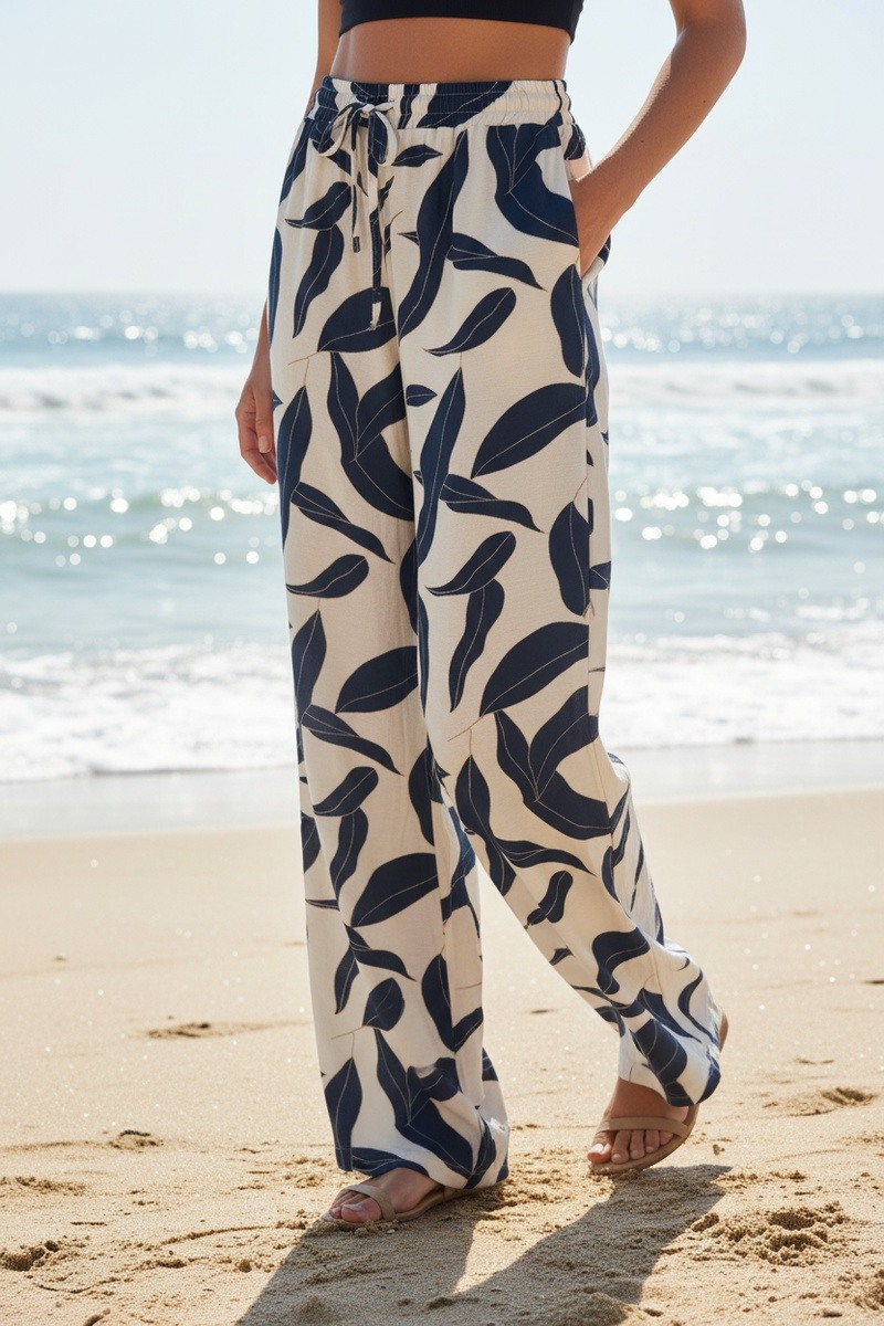 Grossista Lusa Mode - Pantaloni casual a gamba larga con stampa floreale, tasche e coulisse regolabile