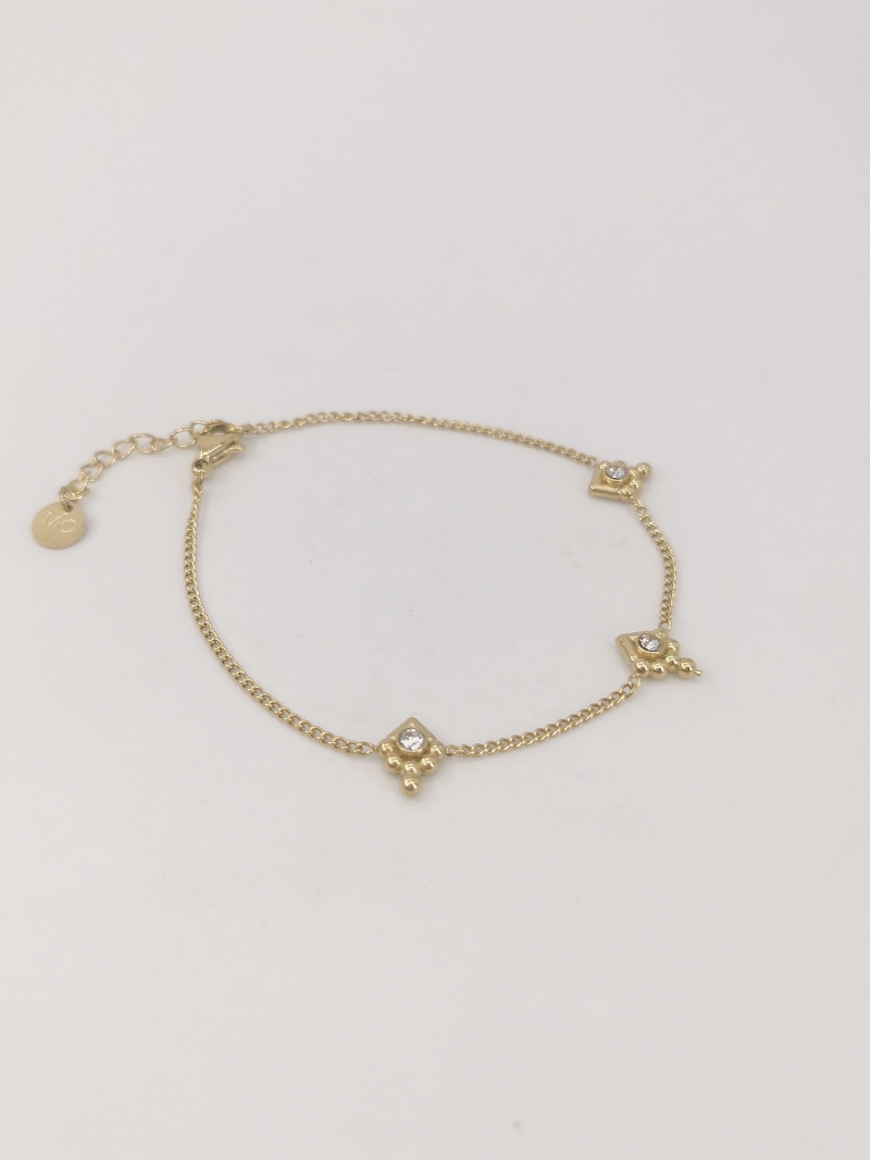 Grossiste MAISON OKAMI - Bracelet fin avec pendentifs en relief et zircons