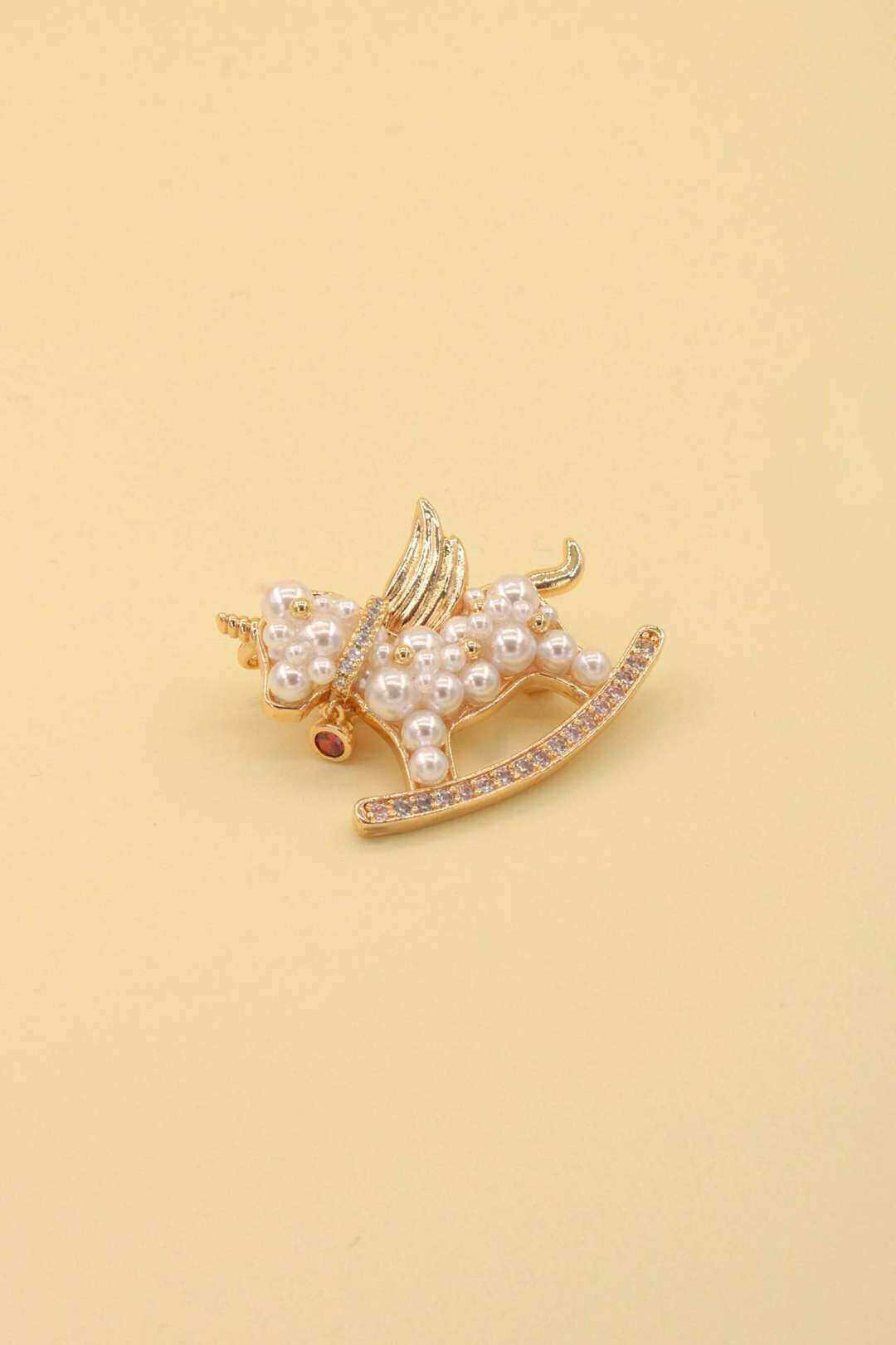 Mayorista MAISON OKAMI - Broche de unicornio oscilante de acero inoxidable