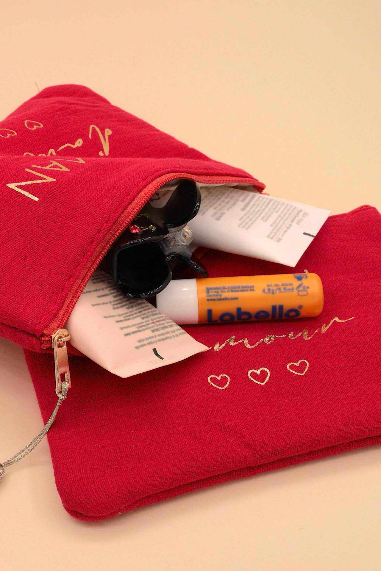 Wholesaler MAISON OKAMI - Trendy clutch with heart pattern and zip closure