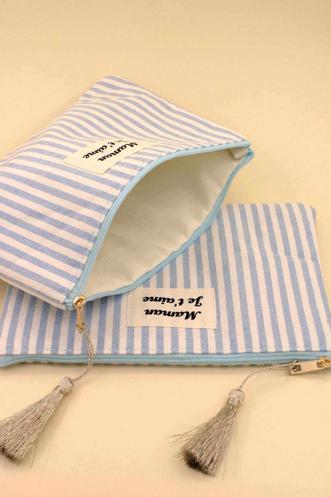Grossista MAISON OKAMI - Pochette a Righe con Nappe e Chiusura con Cerniera