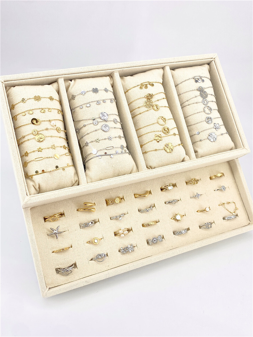 Grossista Missra Paris - Set di 32 braccialetti e 28 anelli in acciaio inossidabile
