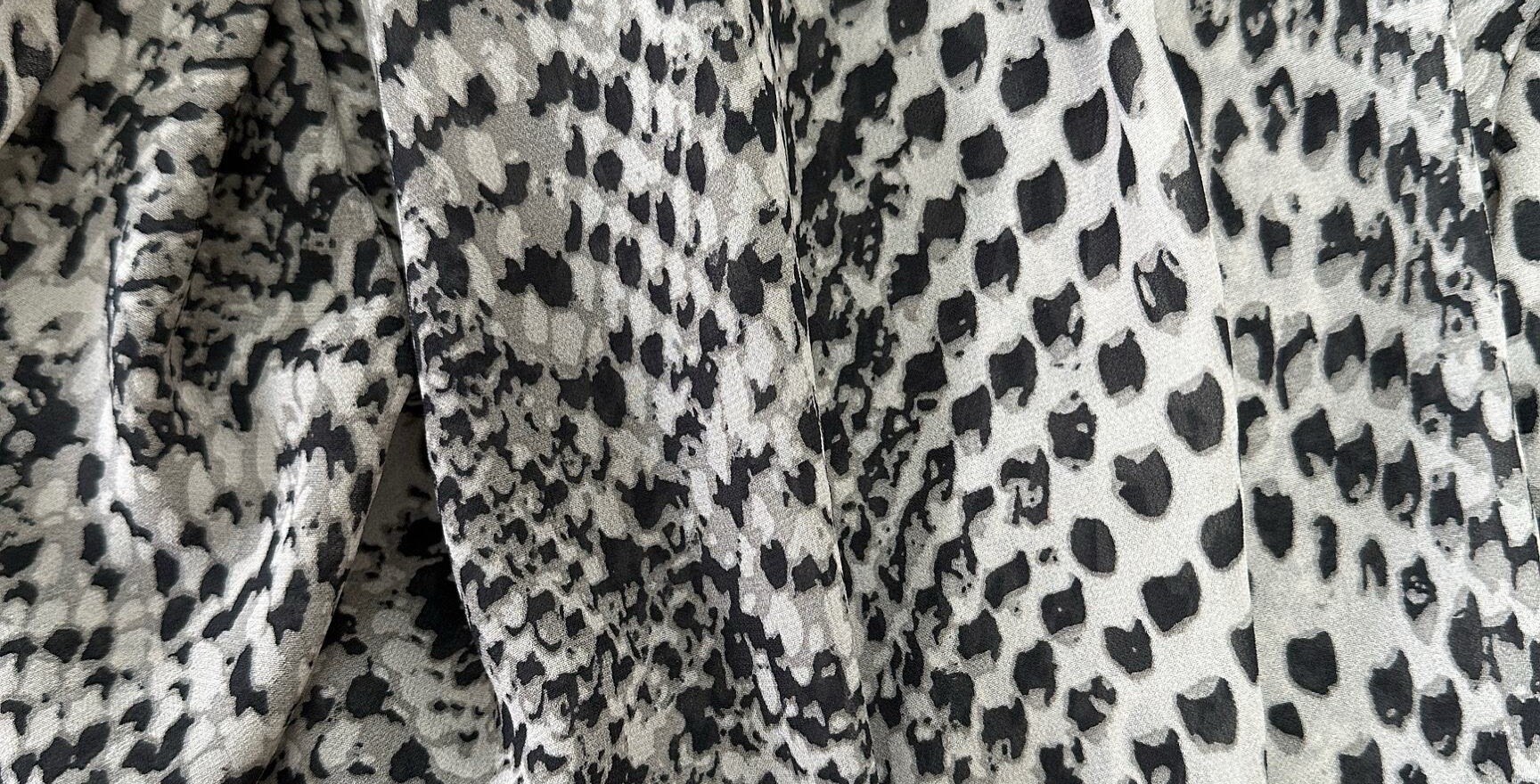 Flowy python print blouse with ruffles and a tie at the neckline ...