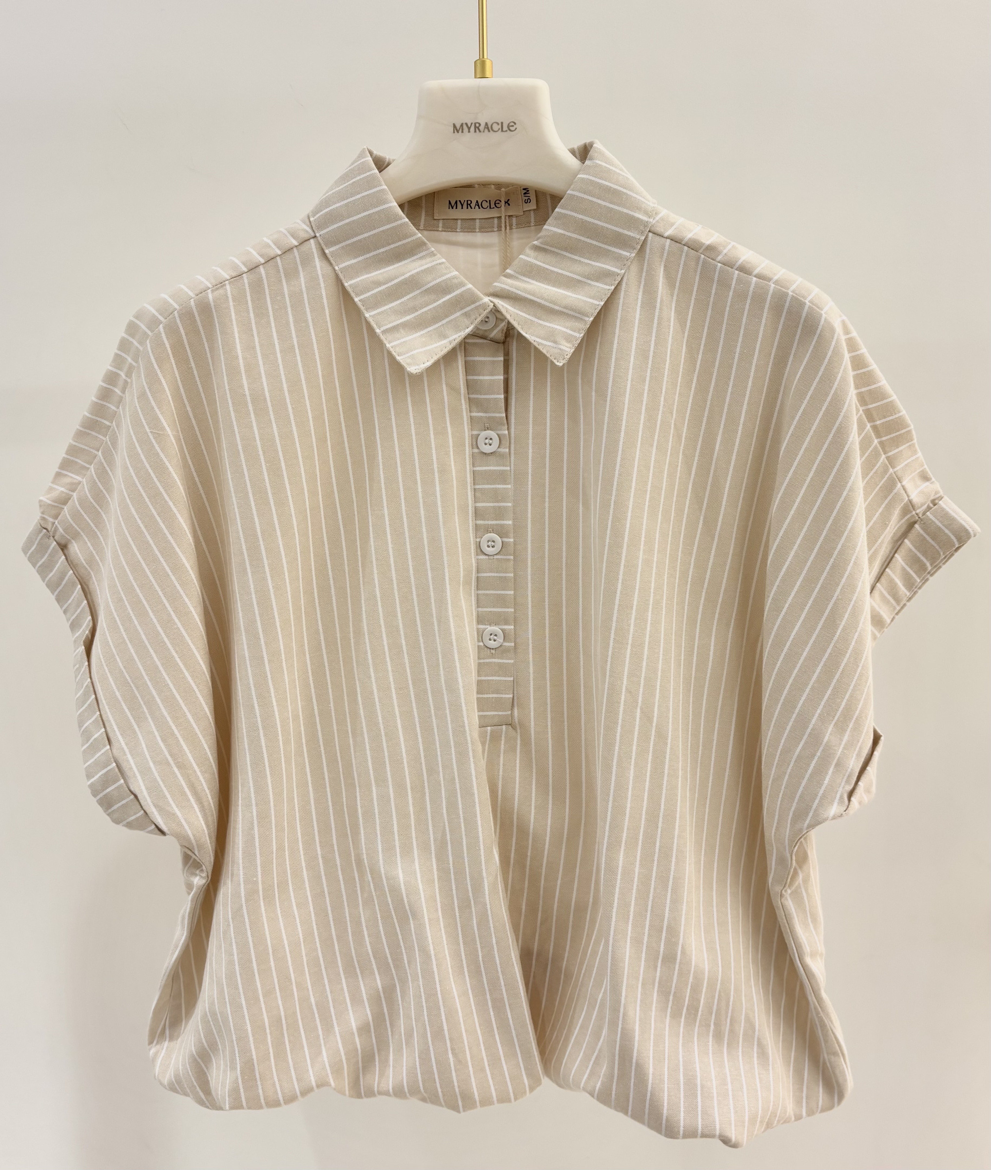 Grossista MYRACLEX - Una blusa a righe con orlo elastico effetto sbuffo