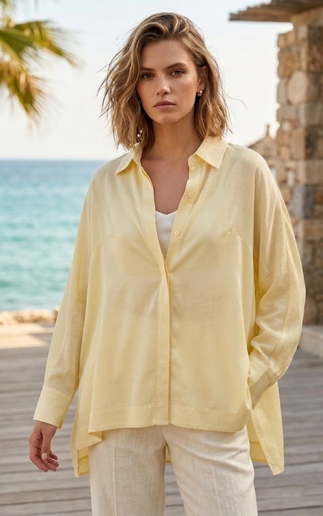 Grossista MYRACLEX - Una camicia ampia e fluida con colletto classico, con abbottonatura nascosta e maniche lunghe