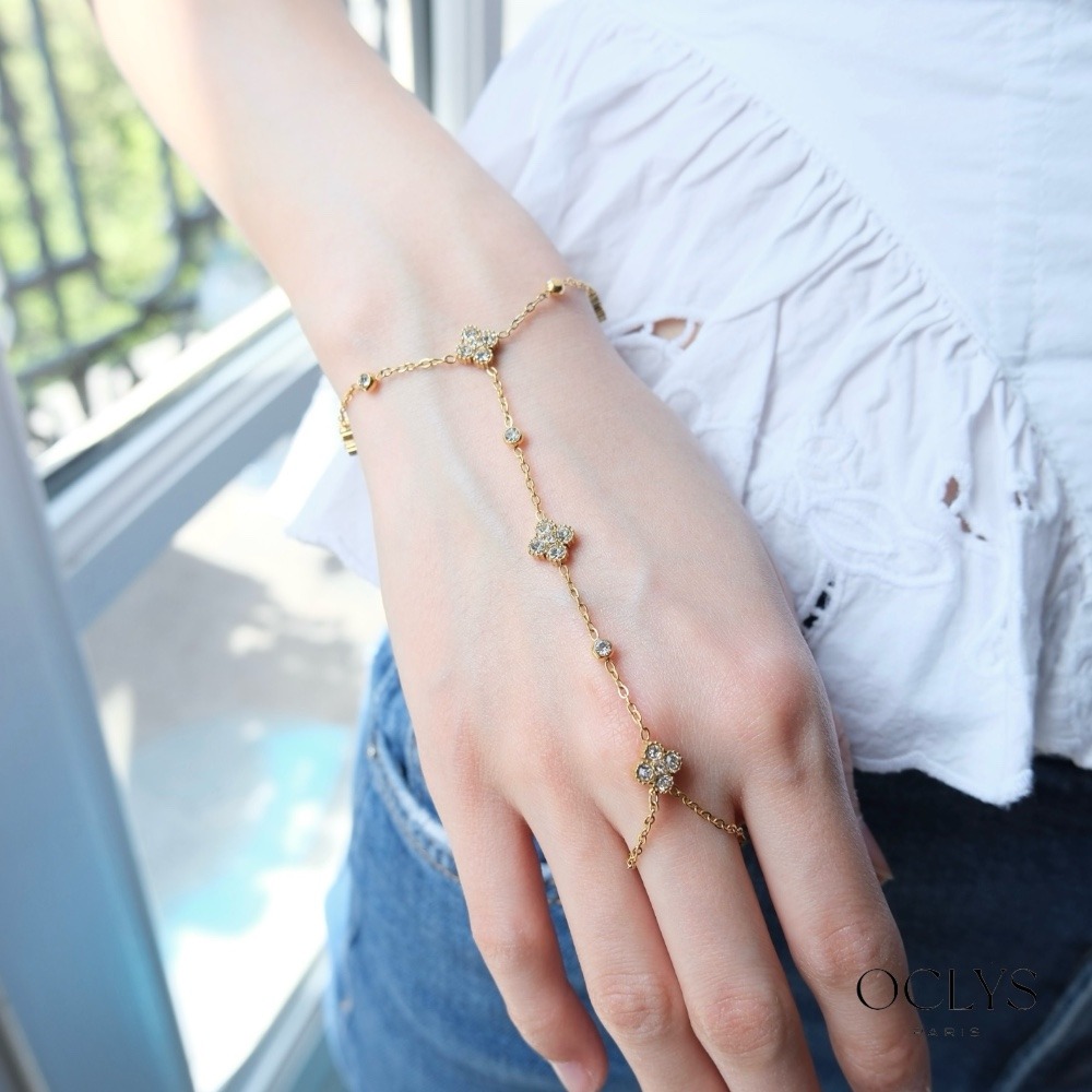 Mayorista OCLYS - Joya de mano de acero inoxidable dorado con flores de strass y bolas de Fiki