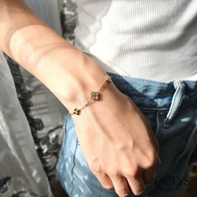 Grossiste OCLYS - Bracelet fleurs strass acier inoxydable doré Duana Grossiste OCLYS - Bracelet fleurs strass acier inoxydable doré Duana