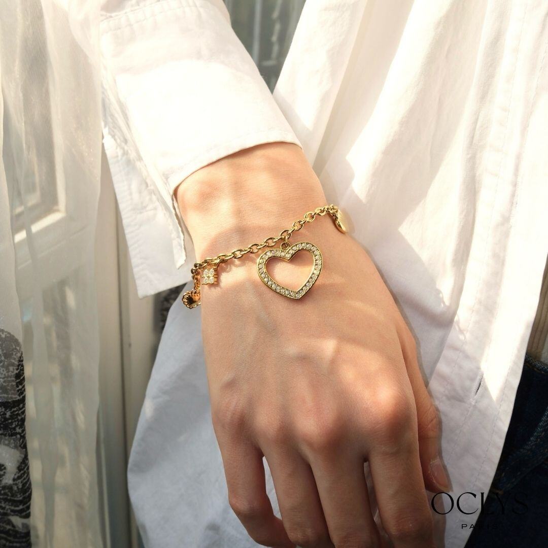 Grossista OCLYS - Bracciale Dania in acciaio inossidabile dorato con ciondoli a cuore e strass