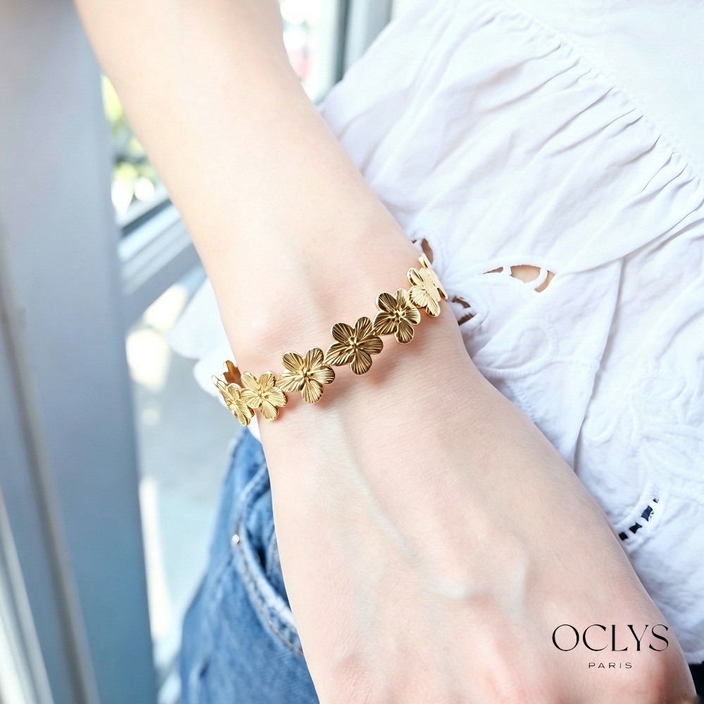 Mayorista OCLYS - Brazalete tipo puño floral de acero inoxidable Ella dorado