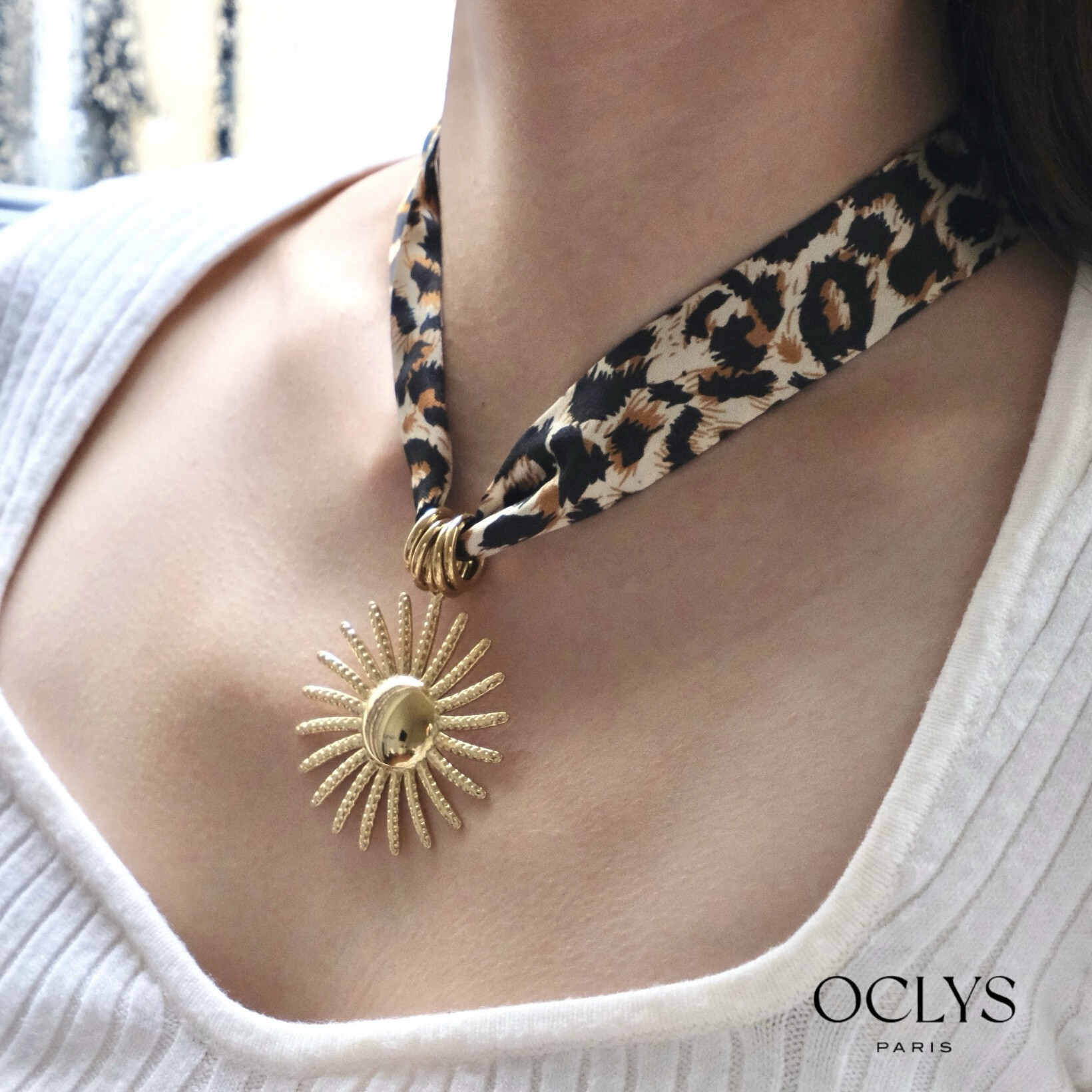 Mayorista OCLYS - Collar de cinta de tela de leopardo con cruz de acero Zephyra