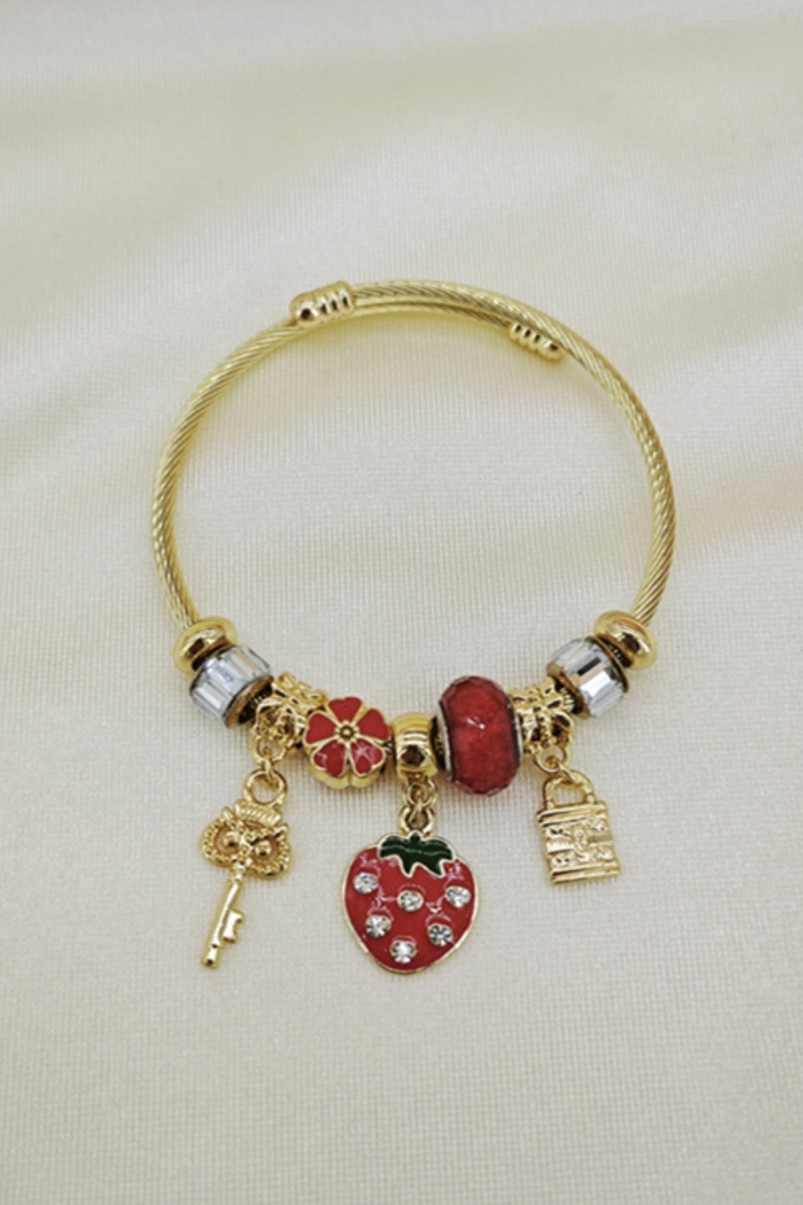 Mayorista Orient Express - Pulsera adornada con dije de metal