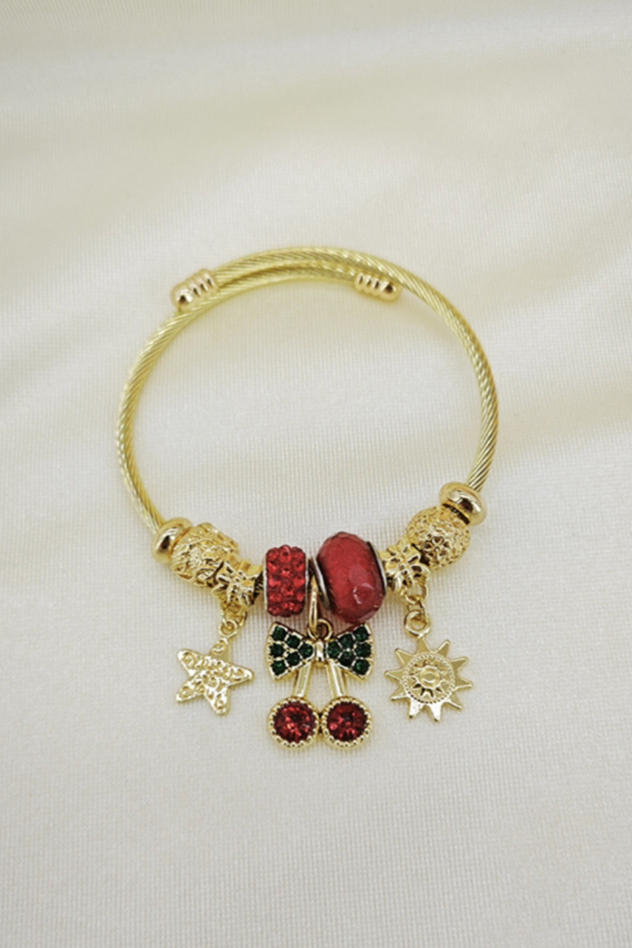 Mayorista Orient Express - Pulsera adornada con dije de metal