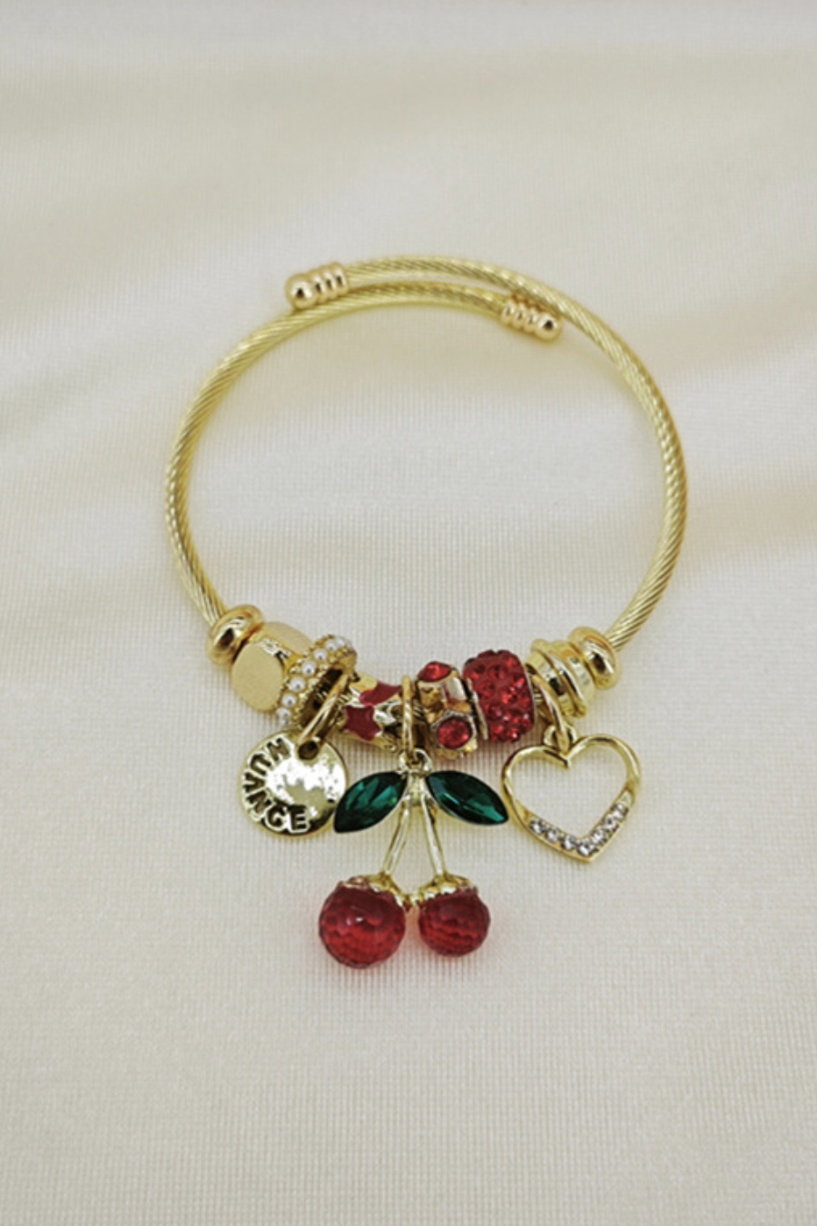 Mayorista Orient Express - Pulsera adornada con dije de metal