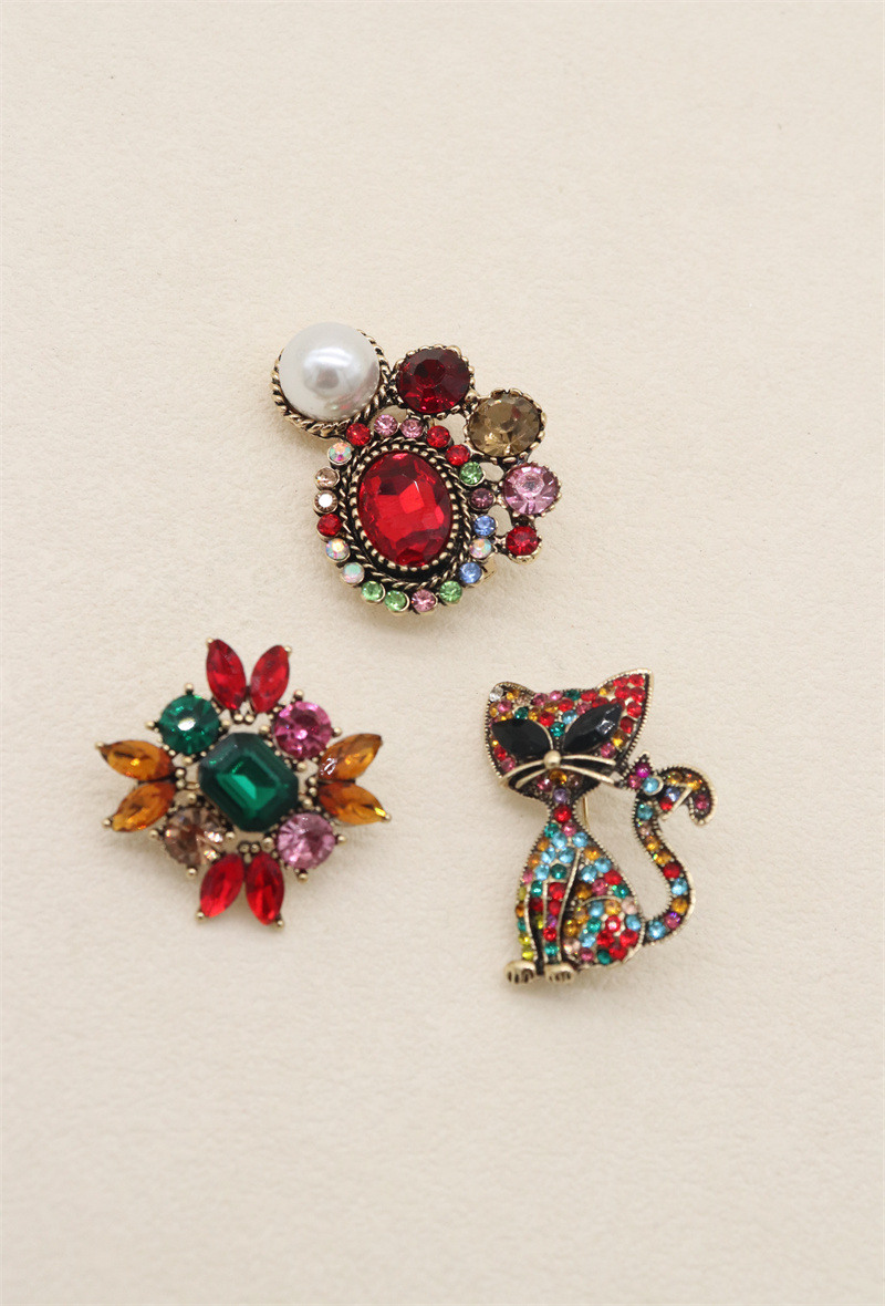 Grossista Orient Express - Set di 3 spille in metallo e strass