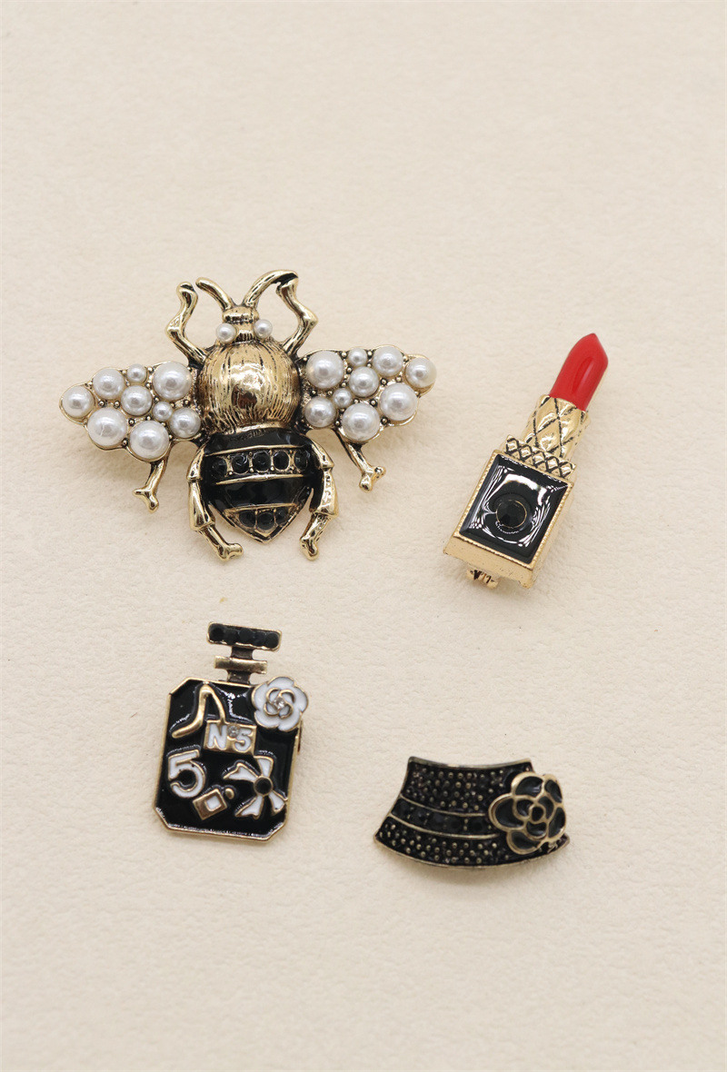 Grossista Orient Express - Set di 4 spille in metallo e strass