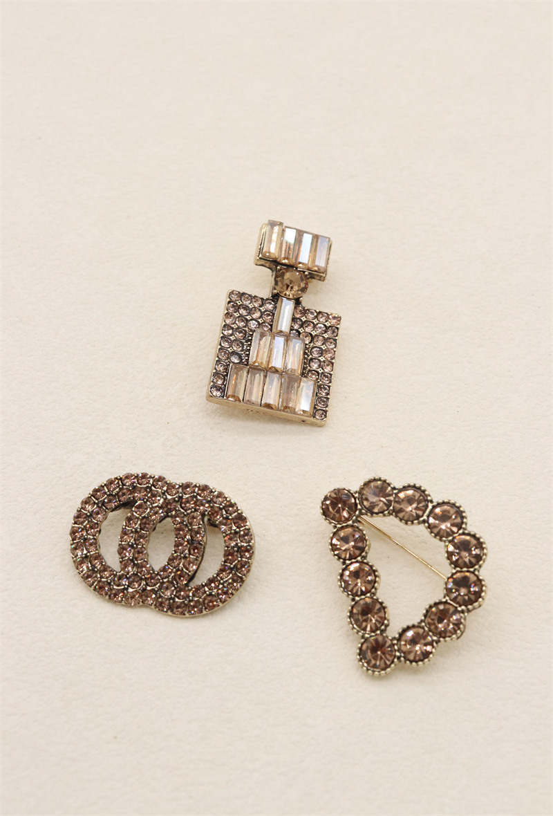 Grossista Orient Express - Set di 3 spille in metallo e strass
