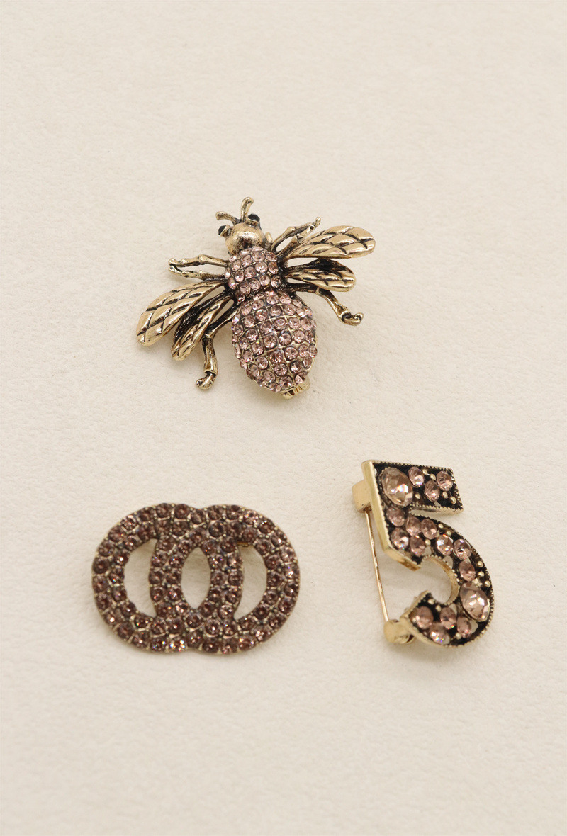 Grossista Orient Express - Set di 3 spille in metallo e strass