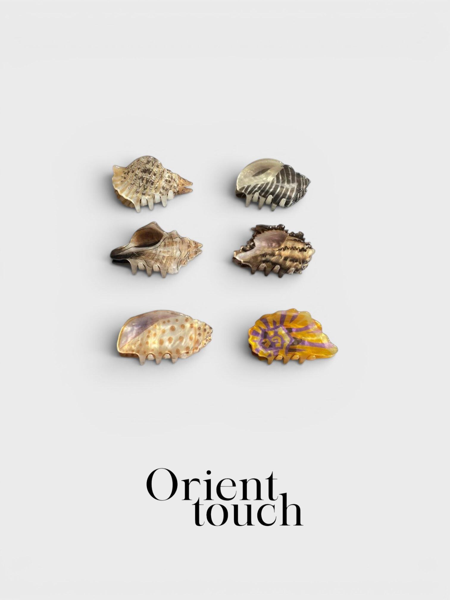 Grossiste ORIENT TOUCH - PINCES COQUILLAGE