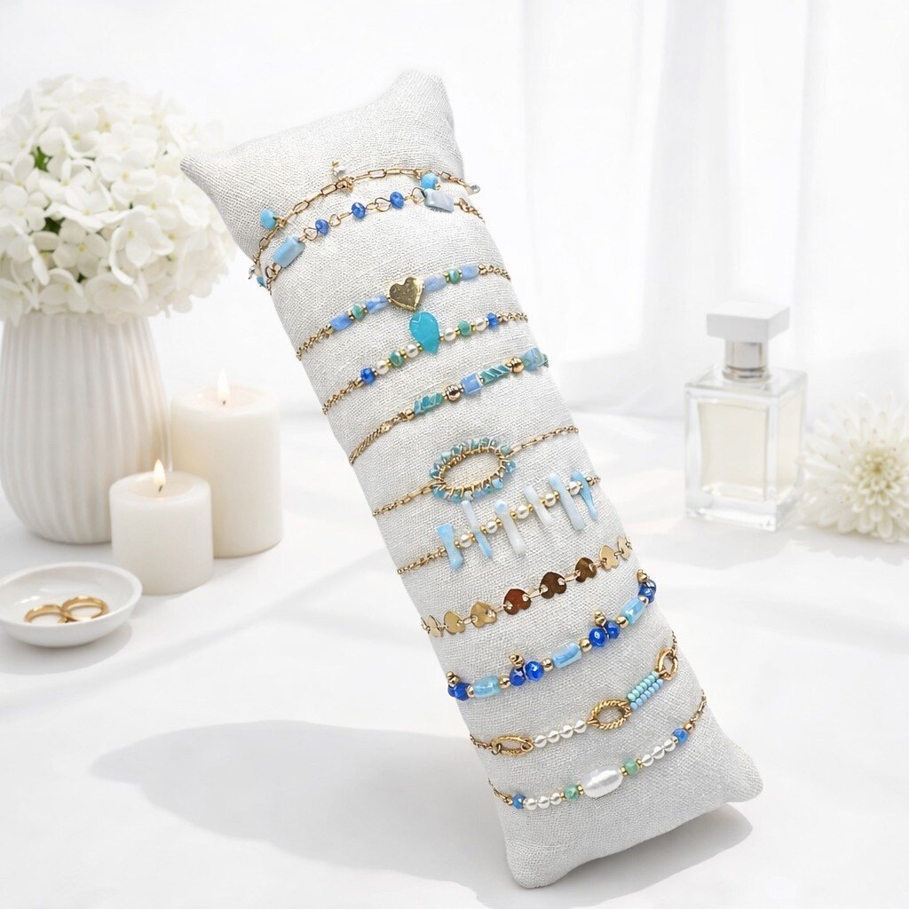 Grossiste ROSE PINK - 12 BRACELETS ORNES DE PIERRES ET DE PERLES EN ACIER INOXYDABLE SUR COUSSIN