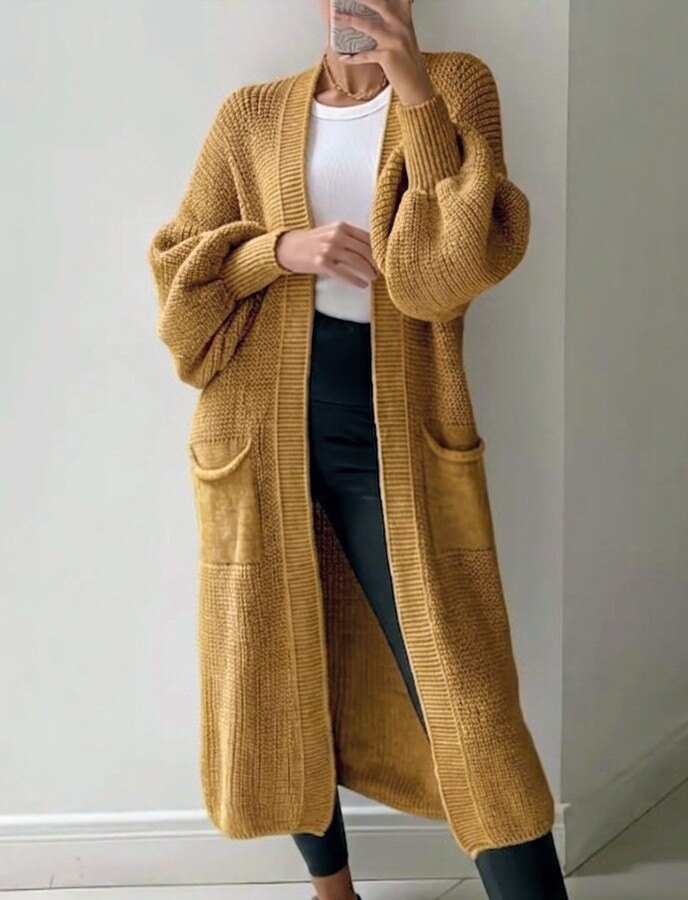Grossiste RZ Fashion - Gilet long avec manches bouffantes. Taille correspond 38 à 46