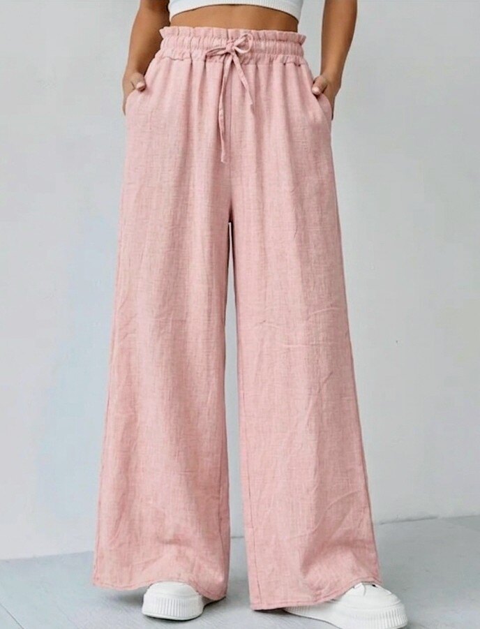 Grossista RZ Fashion - Pantalone ampio con due tasche in materiale effetto lino. La taglia corrisponde alla 38-42.