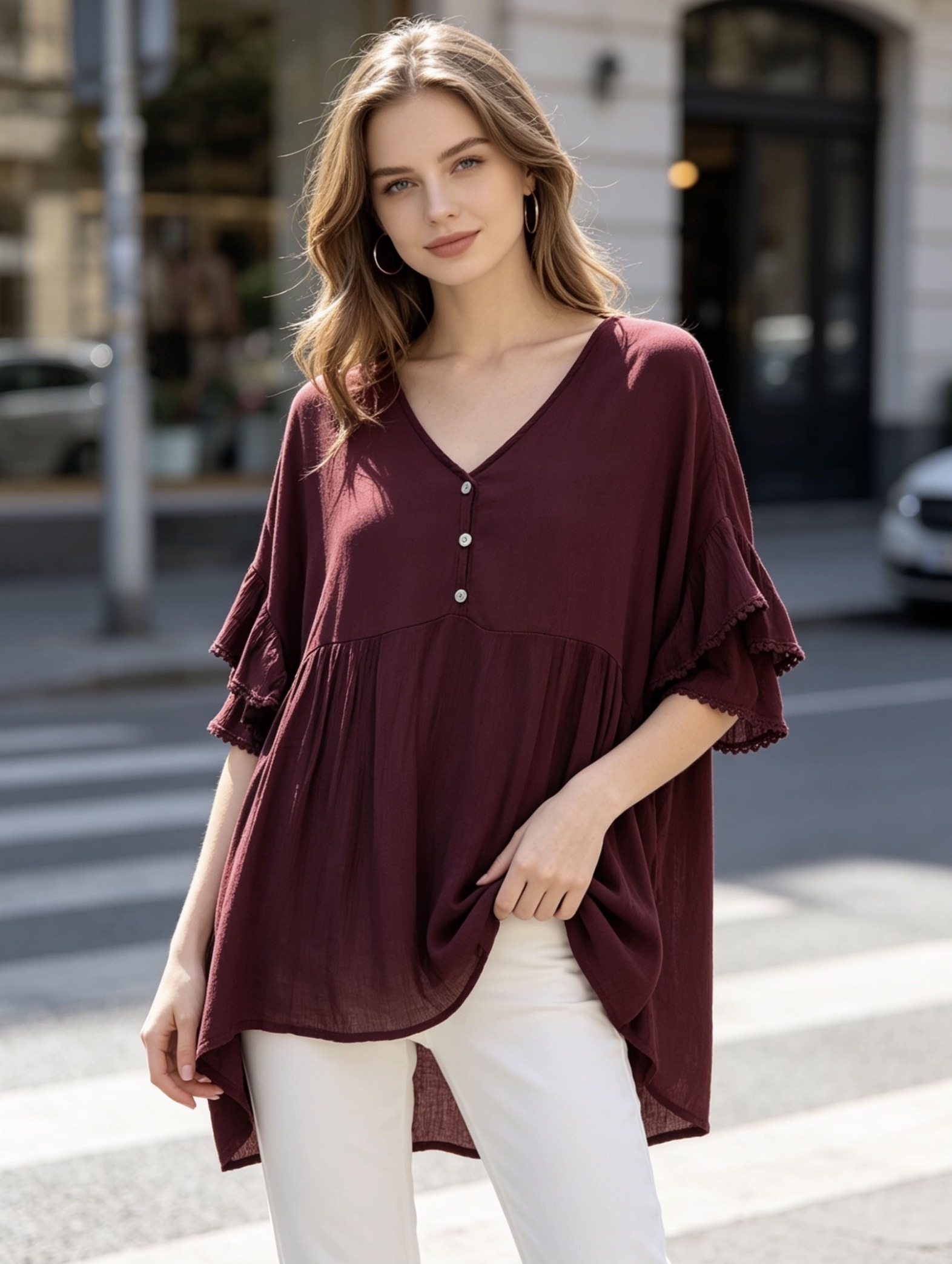 Wholesaler Saeni - Oversized blouse in light and fresh fabric. Features a V-neck finished with visible stitching, partial front closure with three small clear buttons.