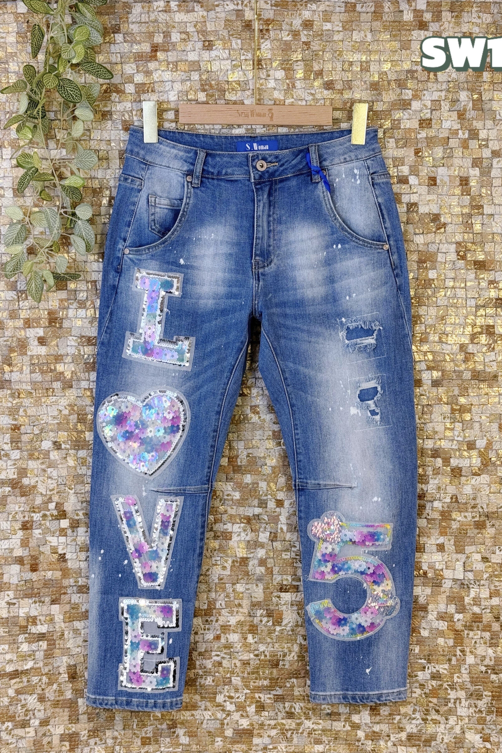 Grossiste Sexy Woman - Jean bleu déchiré avec des paillettes lumineuses, chic décontracté, design original