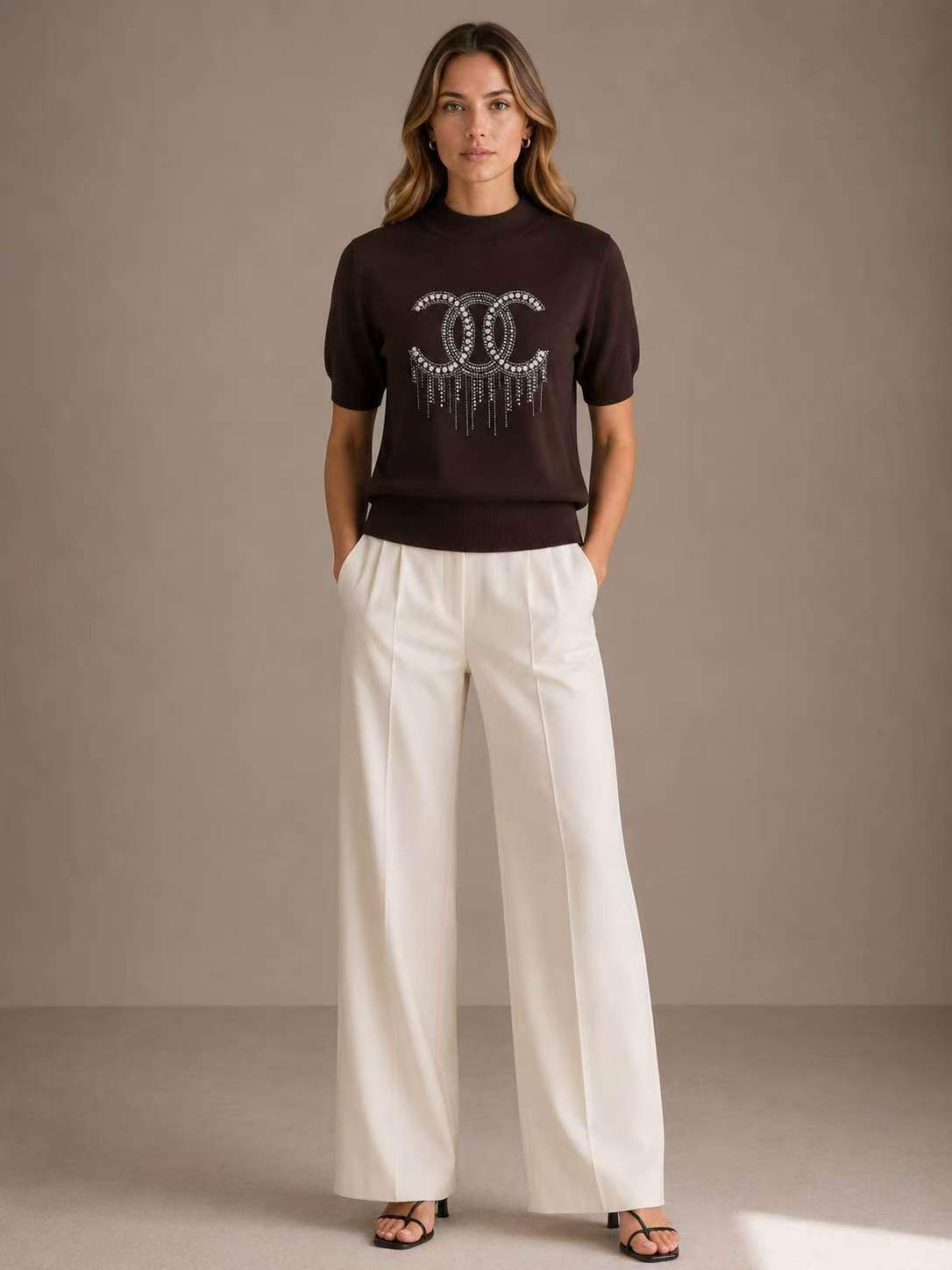 Wholesaler SHEYA FASHION - Mock Neck Fringe Rhinestone Interlocking Logo Short Sleeve Knit Top