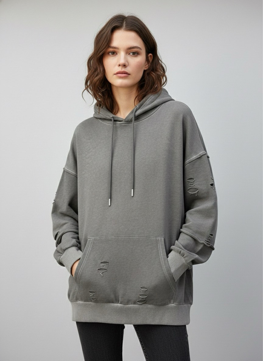 Wholesaler STELLA - Washed hoodie with intentional holes and distressed effect, relaxed fit. Unisex model with streetwear style.